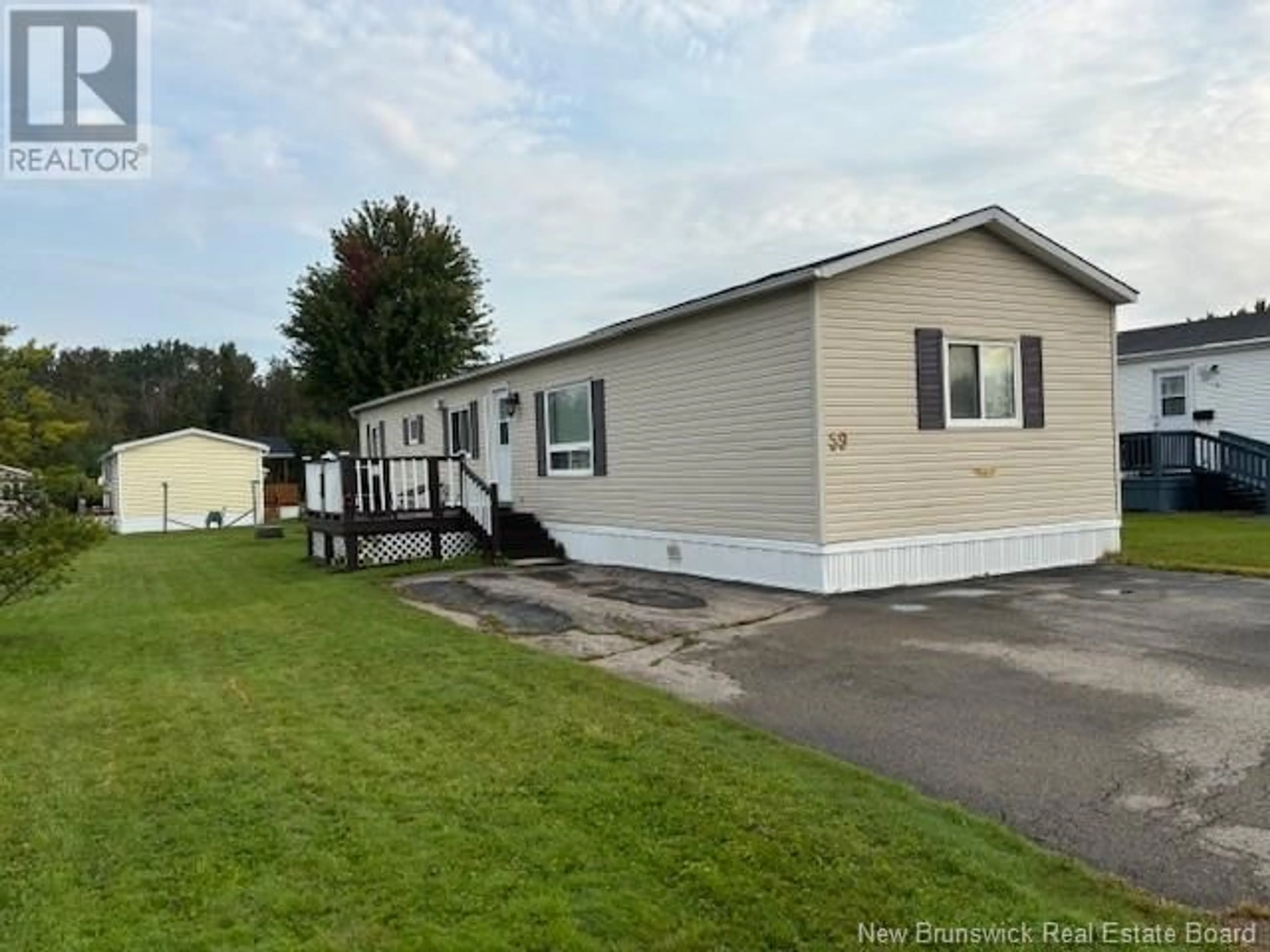 Home with vinyl exterior material for 59 Second Street, Sussex Corner New Brunswick E4E2V9