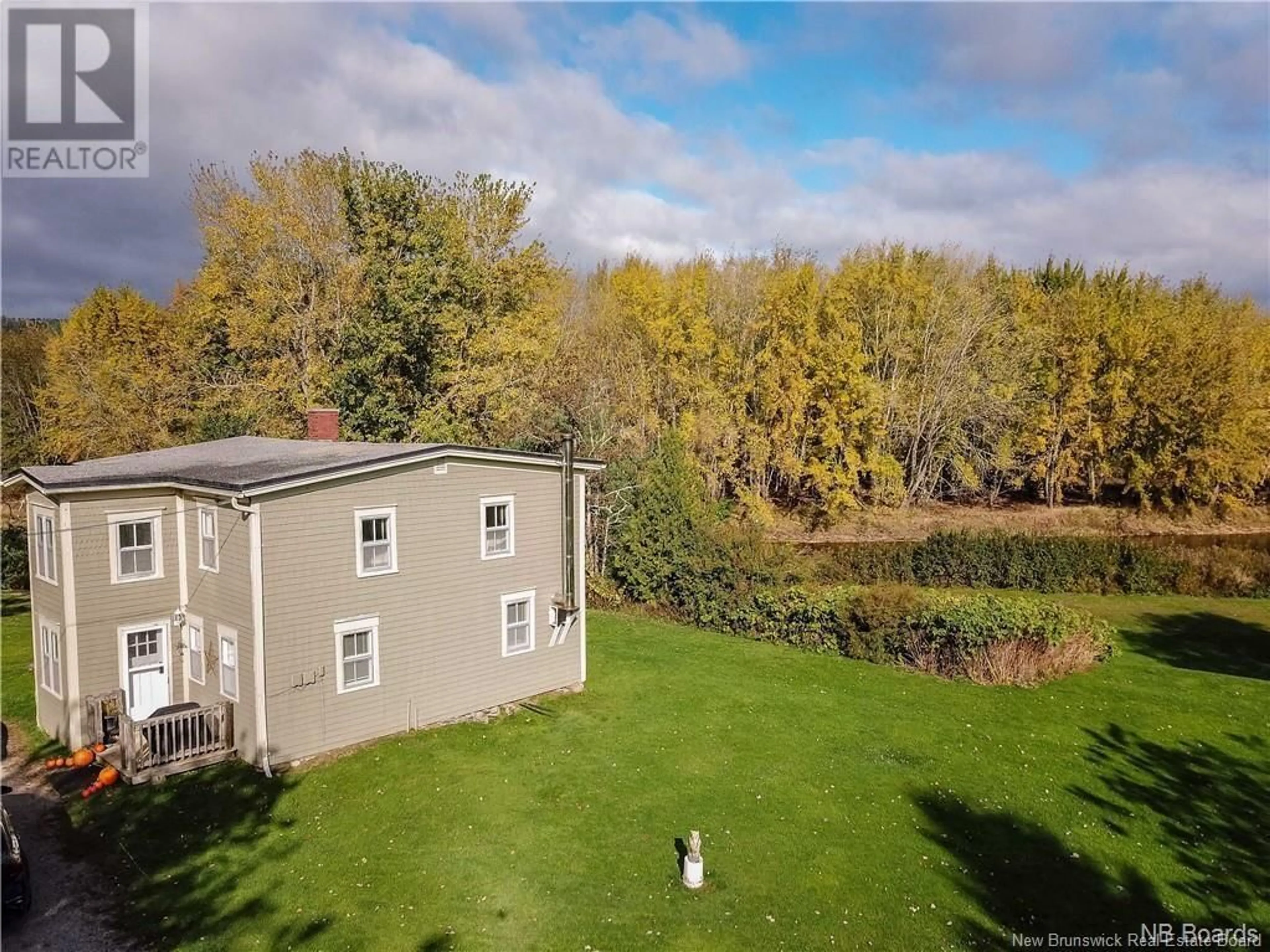 A pic from exterior of the house or condo, the fenced backyard for 9 Brittain Road, Grand Bay-Westfield New Brunswick E5K3M8