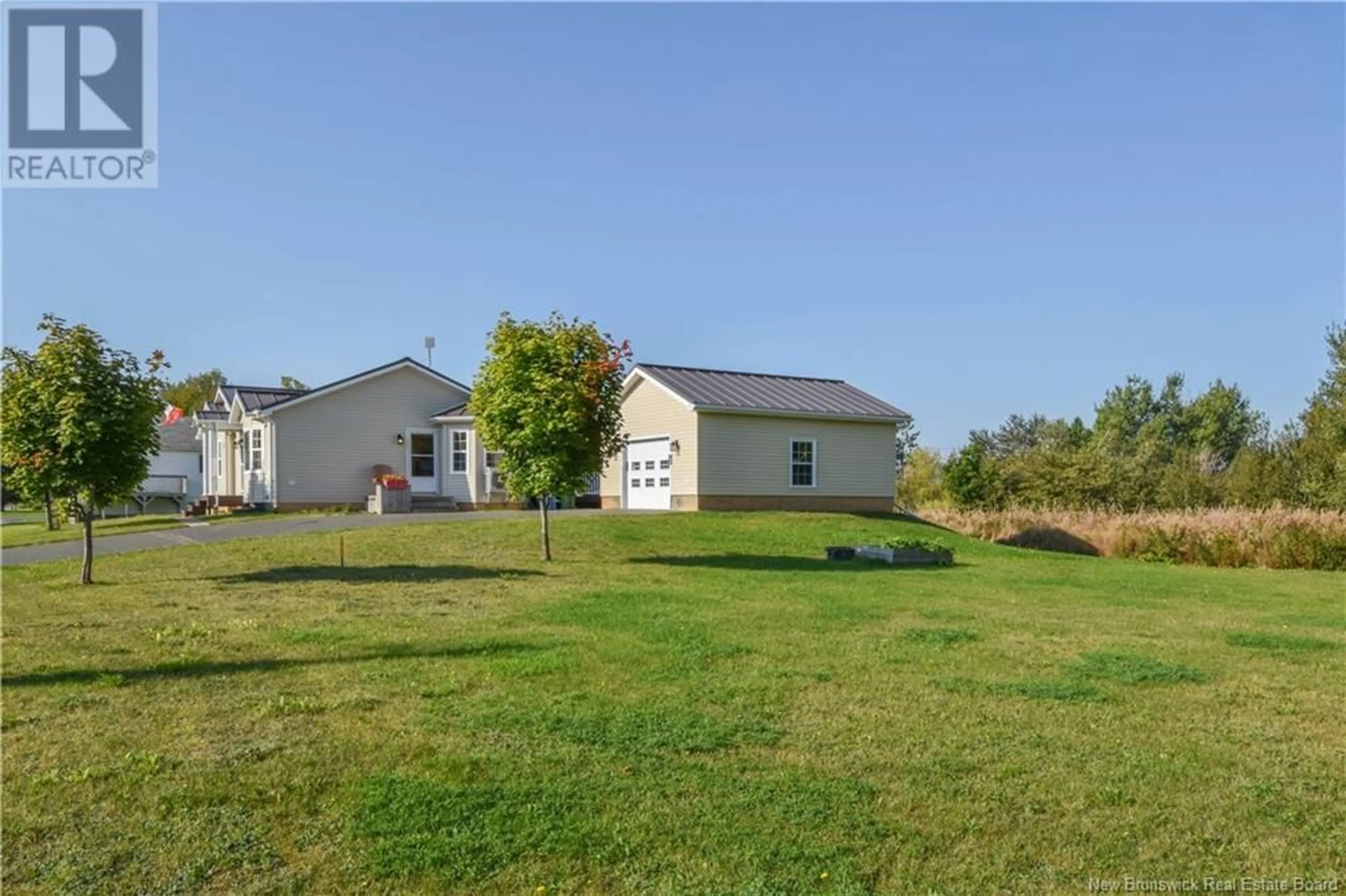 Frontside or backside of a home, the fenced backyard for 149 4e Street, Shippagan New Brunswick E8S1A9