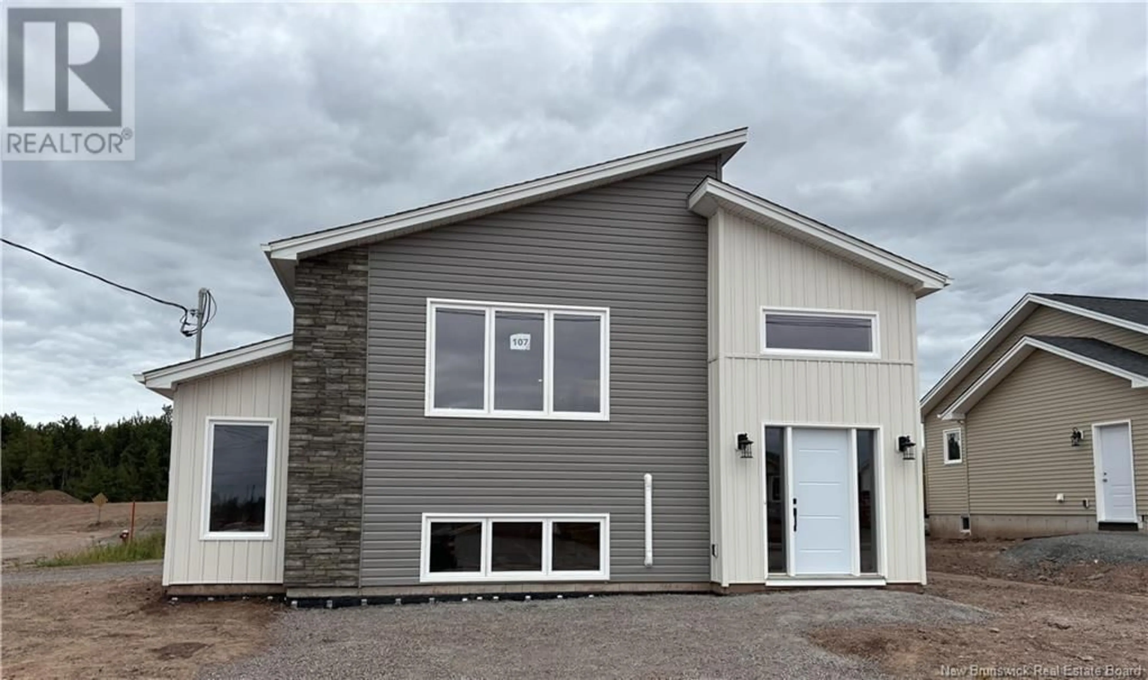 Home with vinyl exterior material for 107 MacIntosh Boulevard, Moncton New Brunswick E1K0A1