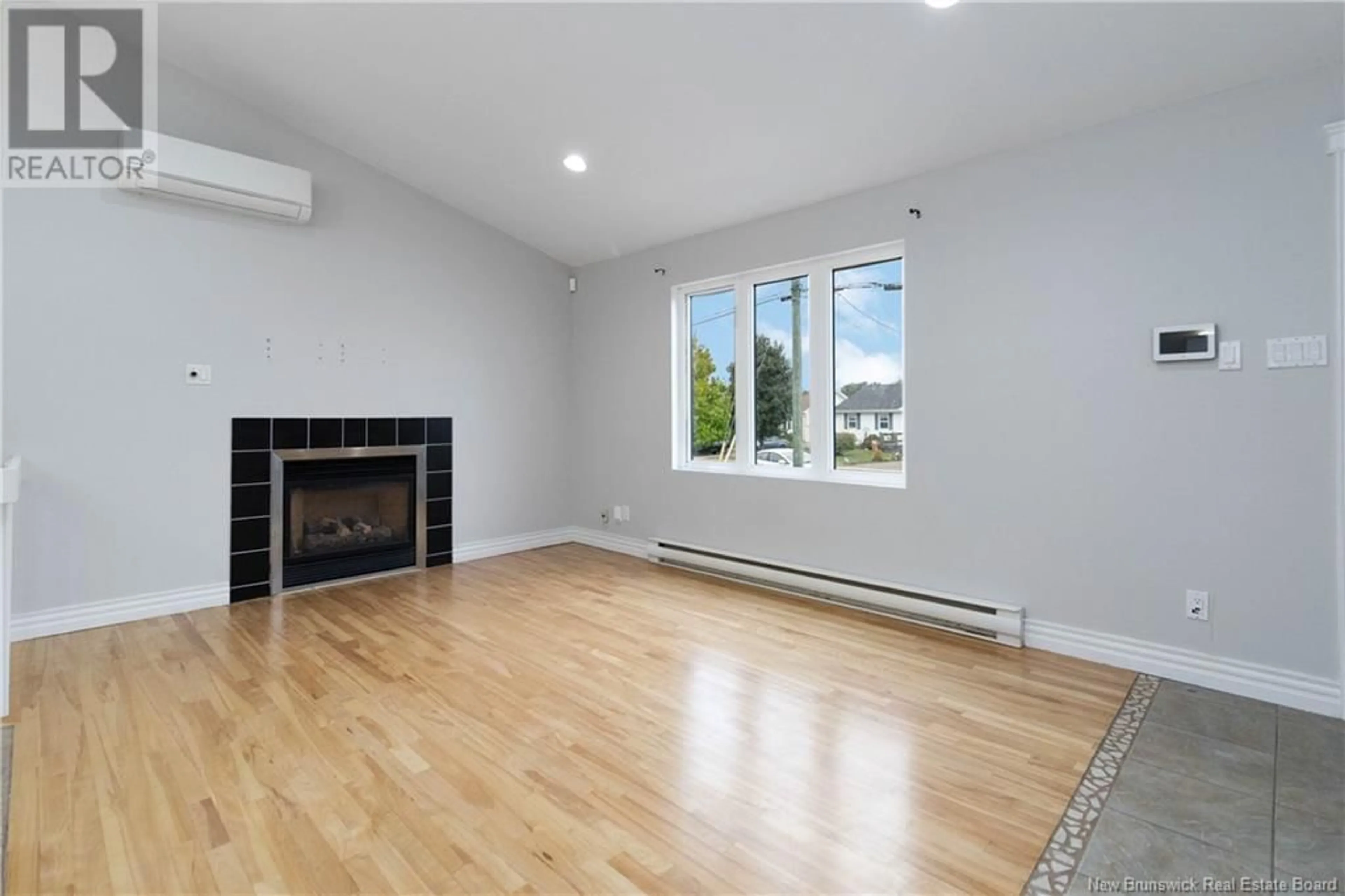 A pic of a room, wood floors for 416 louis Street, Dieppe New Brunswick E1A6X7