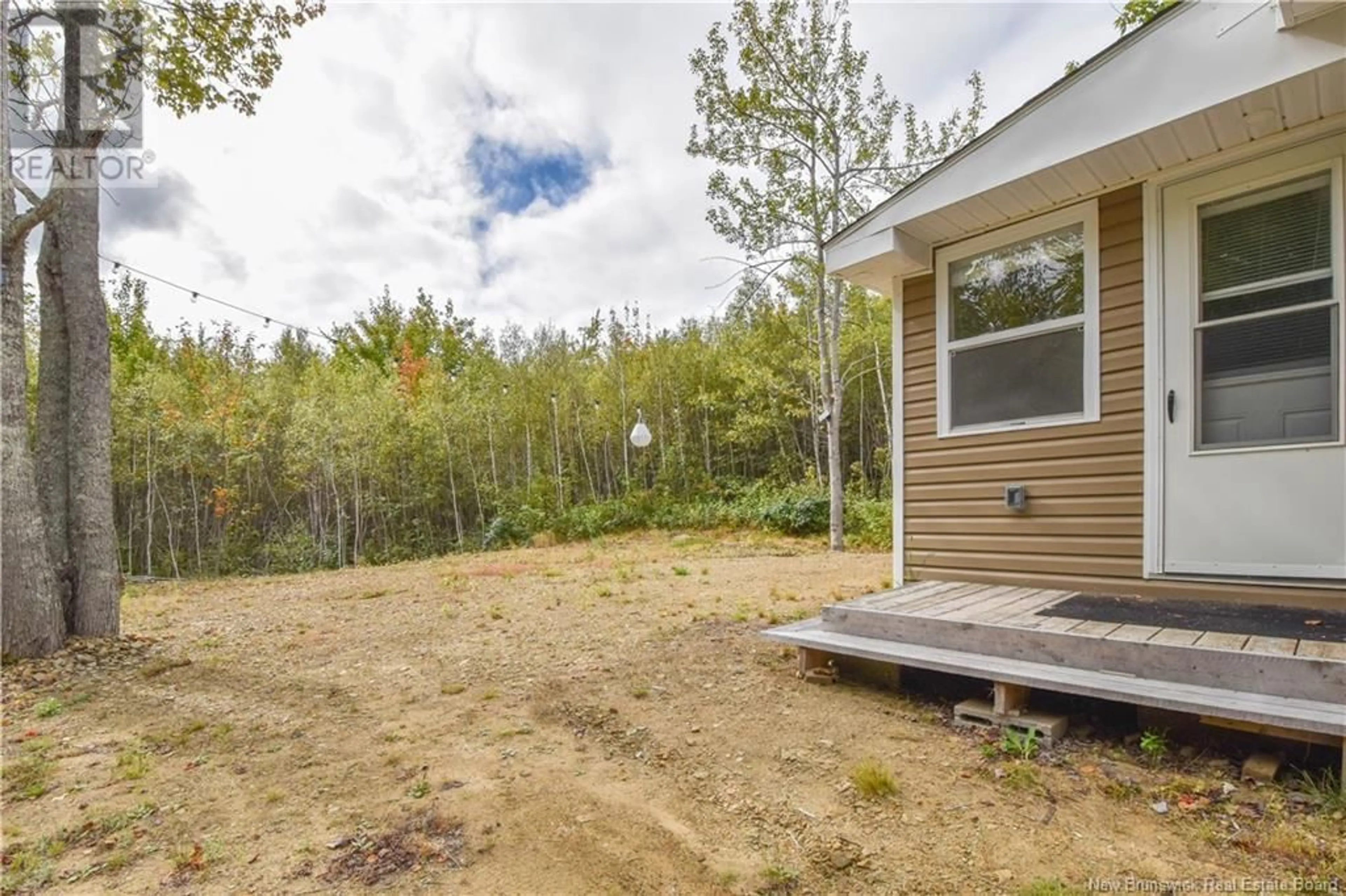 Patio, the fenced backyard for 32 Saint-Pons Road, Tracadie New Brunswick E1X1X7