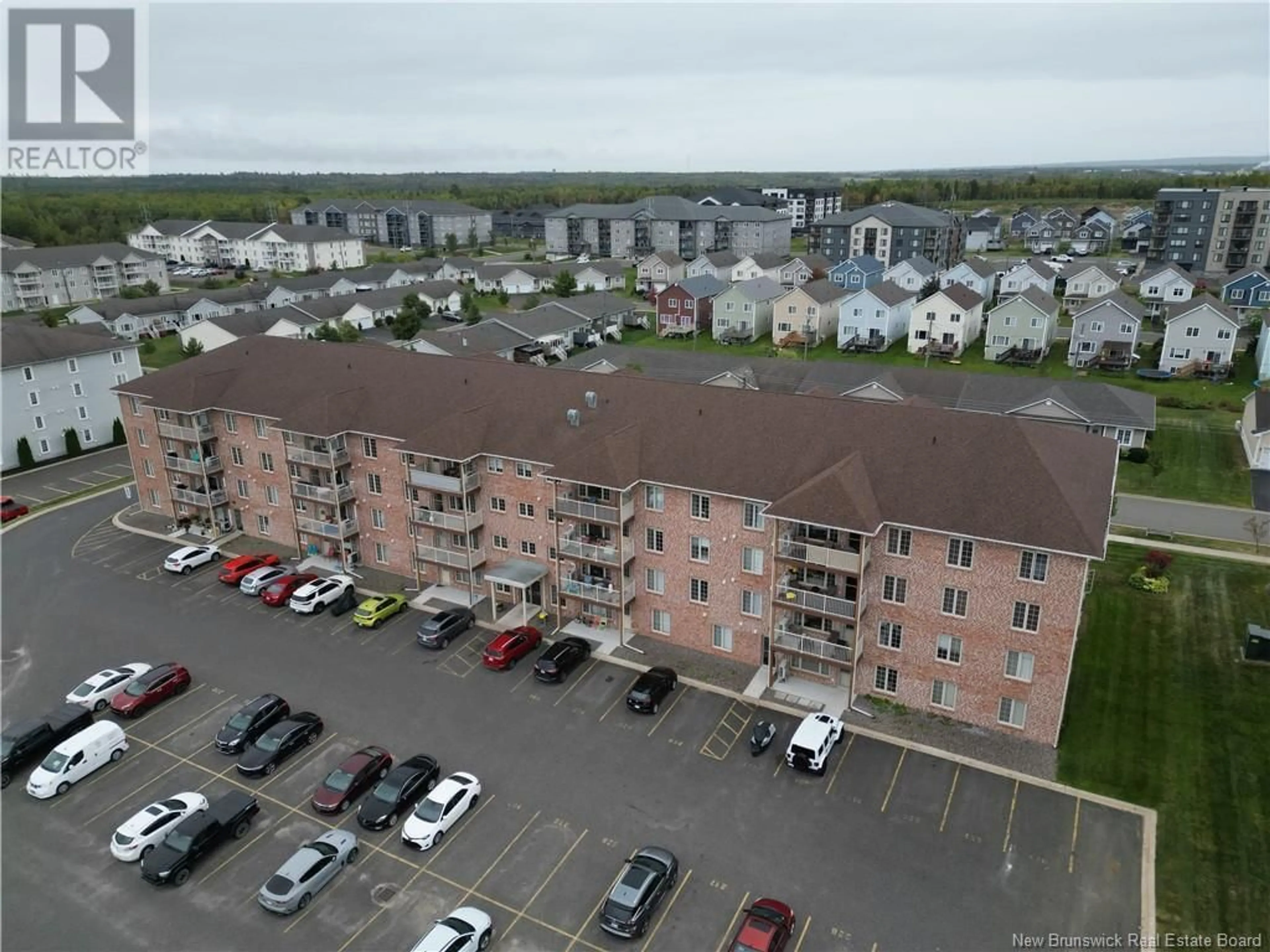 A pic from exterior of the house or condo, the front or back of building for 99 Valcour Drive Unit# 215, Fredericton New Brunswick E3C0J2