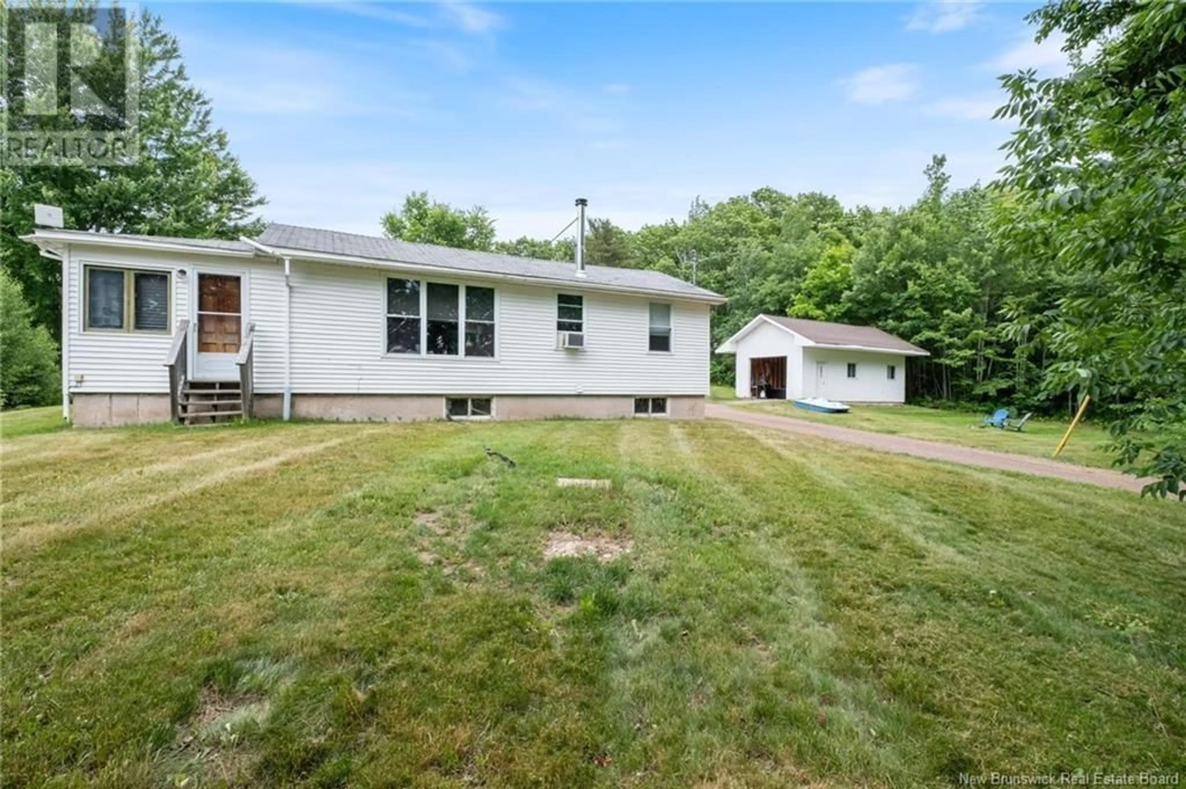 Frontside or backside of a home, the fenced backyard for 1309 Route 715, Lower Cambridge New Brunswick E4C3R1