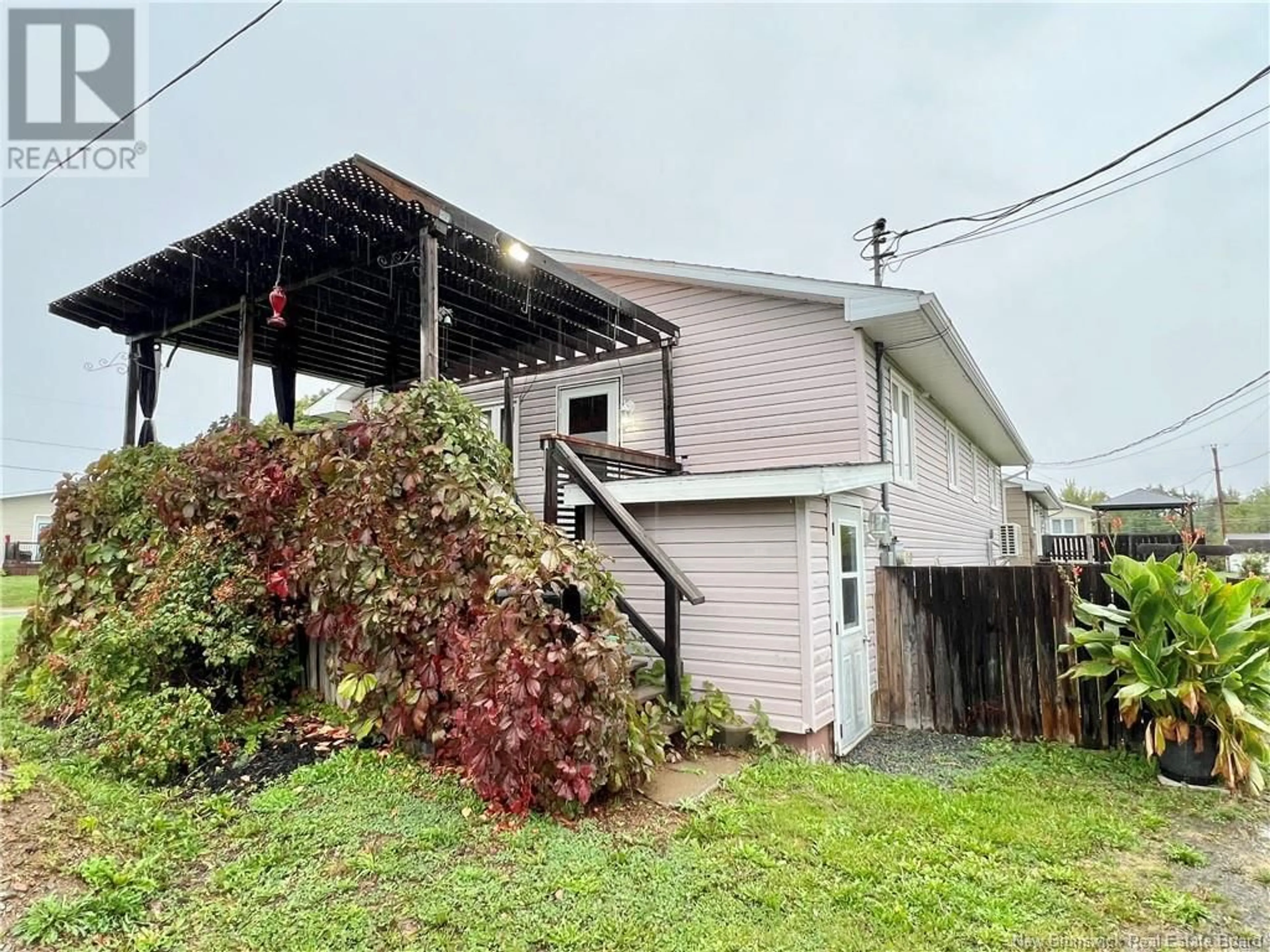 Frontside or backside of a home, the fenced backyard for 1100 Mercury Street, Bathurst New Brunswick E2A4E8