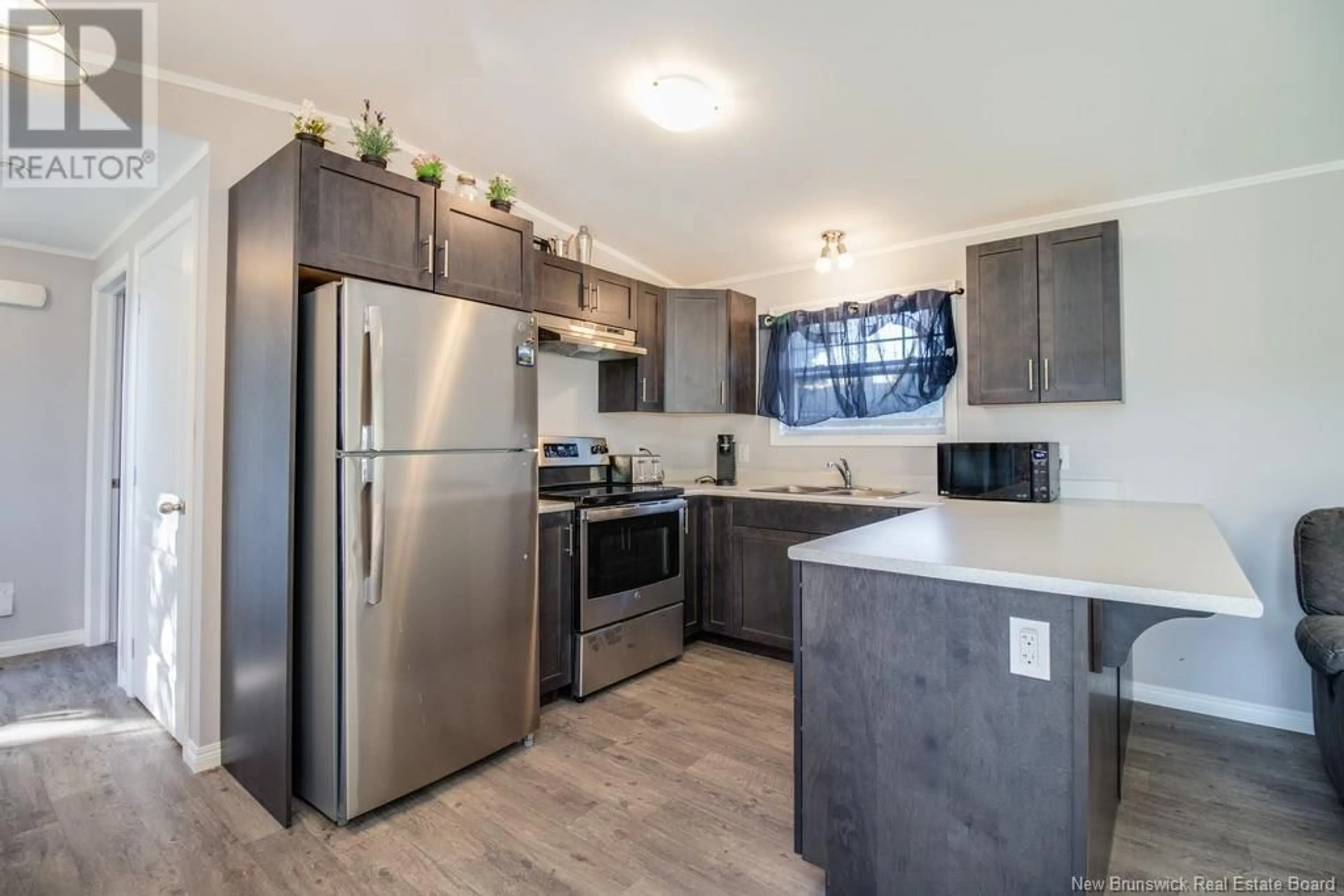 Open concept kitchen for 56 102 Route, Burton New Brunswick E2V2Y8