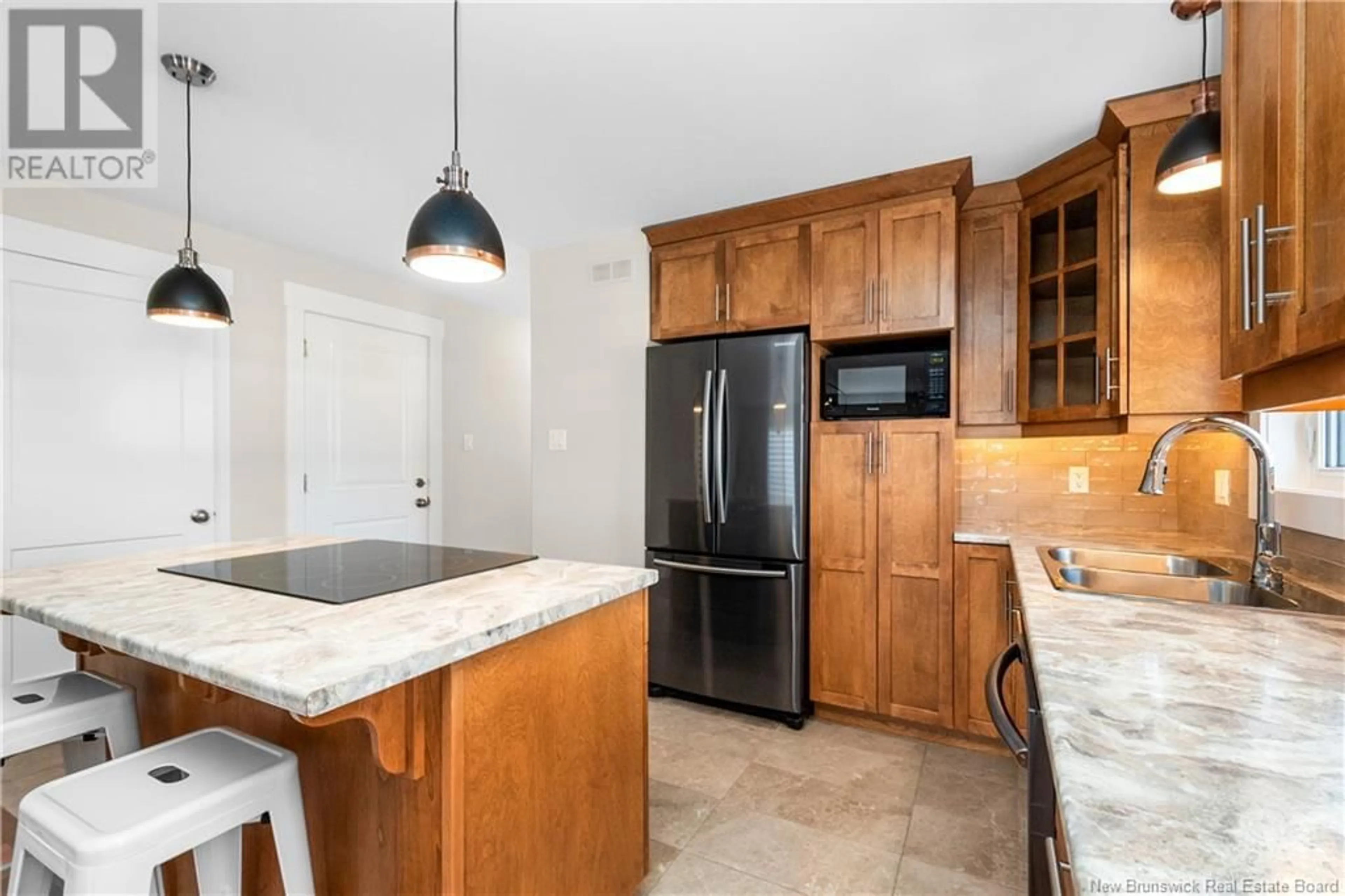 Open concept kitchen for 26 Aime Street, Dieppe New Brunswick E1A9M3