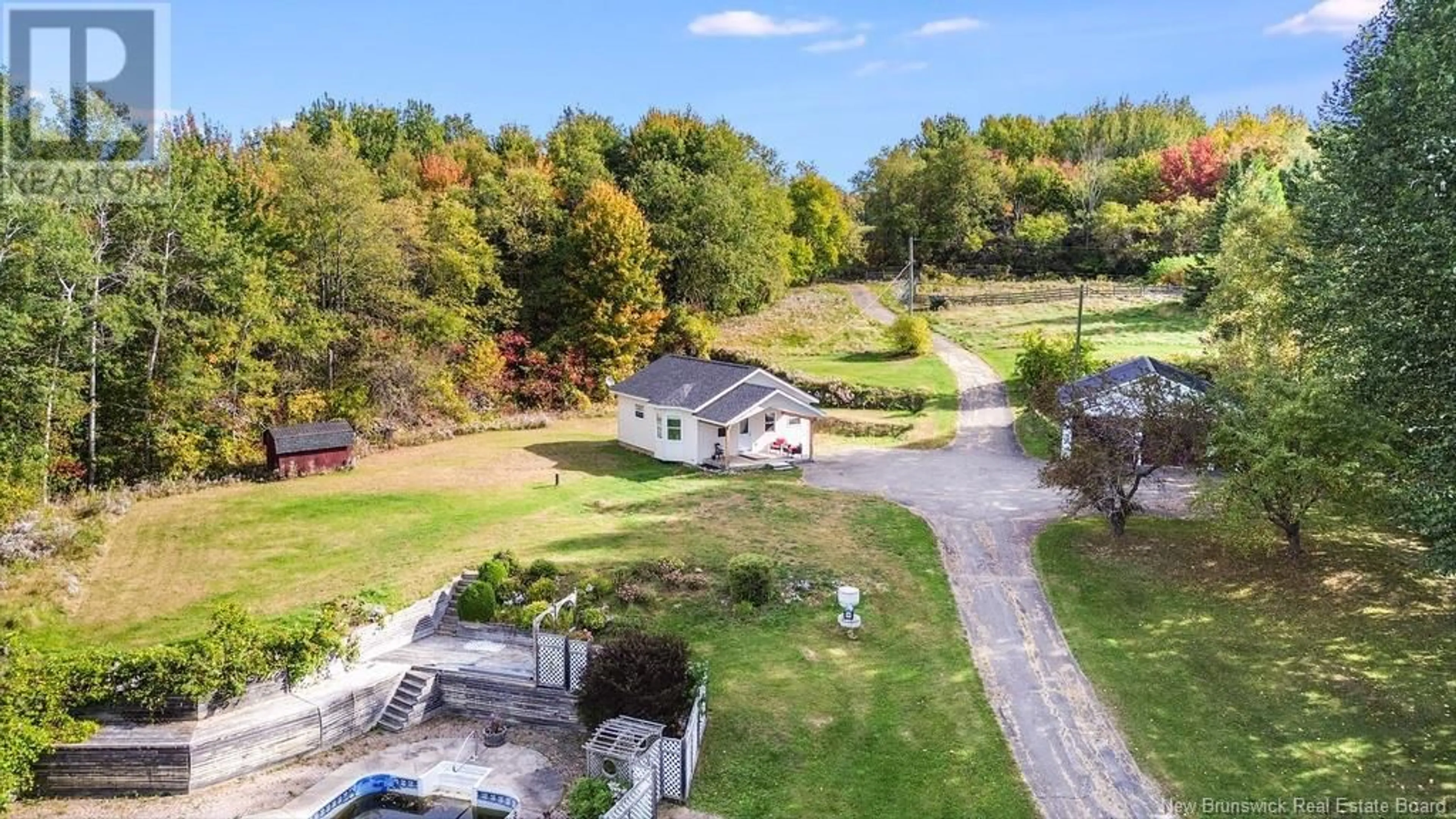 A pic from exterior of the house or condo, the fenced backyard for 13 Harmon Lane, Peel New Brunswick E7L3Y3