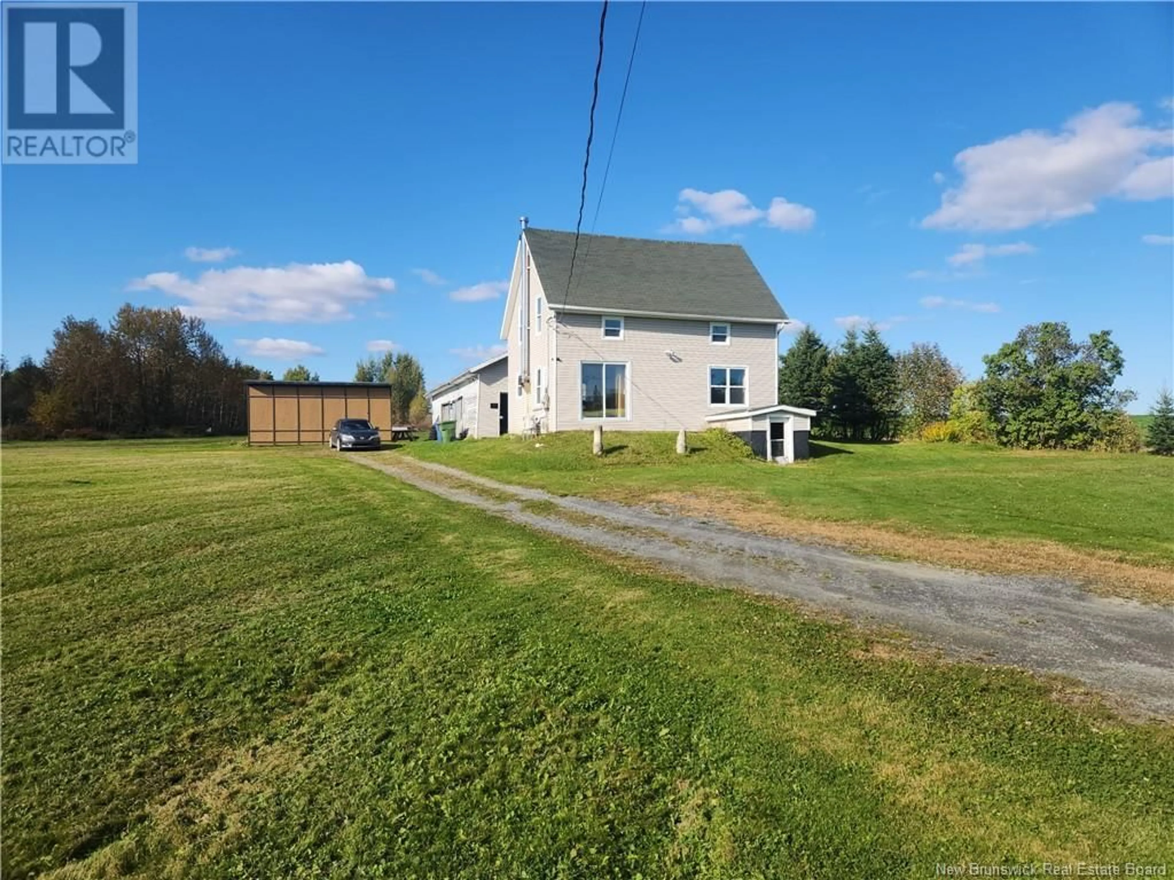 Frontside or backside of a home, the fenced backyard for 1132 Coombes Road, Saint-Léonard-Parent New Brunswick E7E2R5