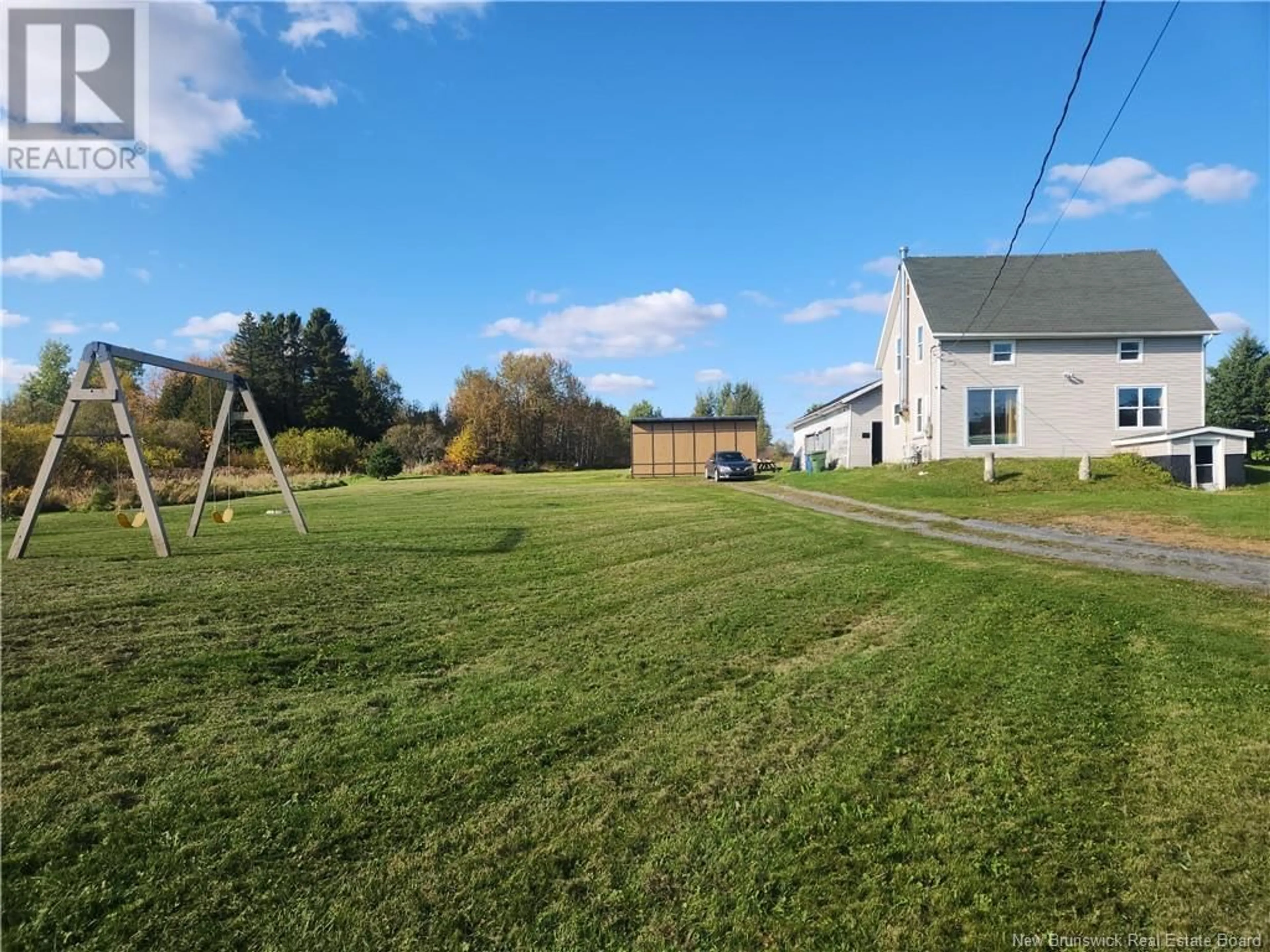 Frontside or backside of a home, the fenced backyard for 1132 Coombes Road, Saint-Léonard-Parent New Brunswick E7E2R5