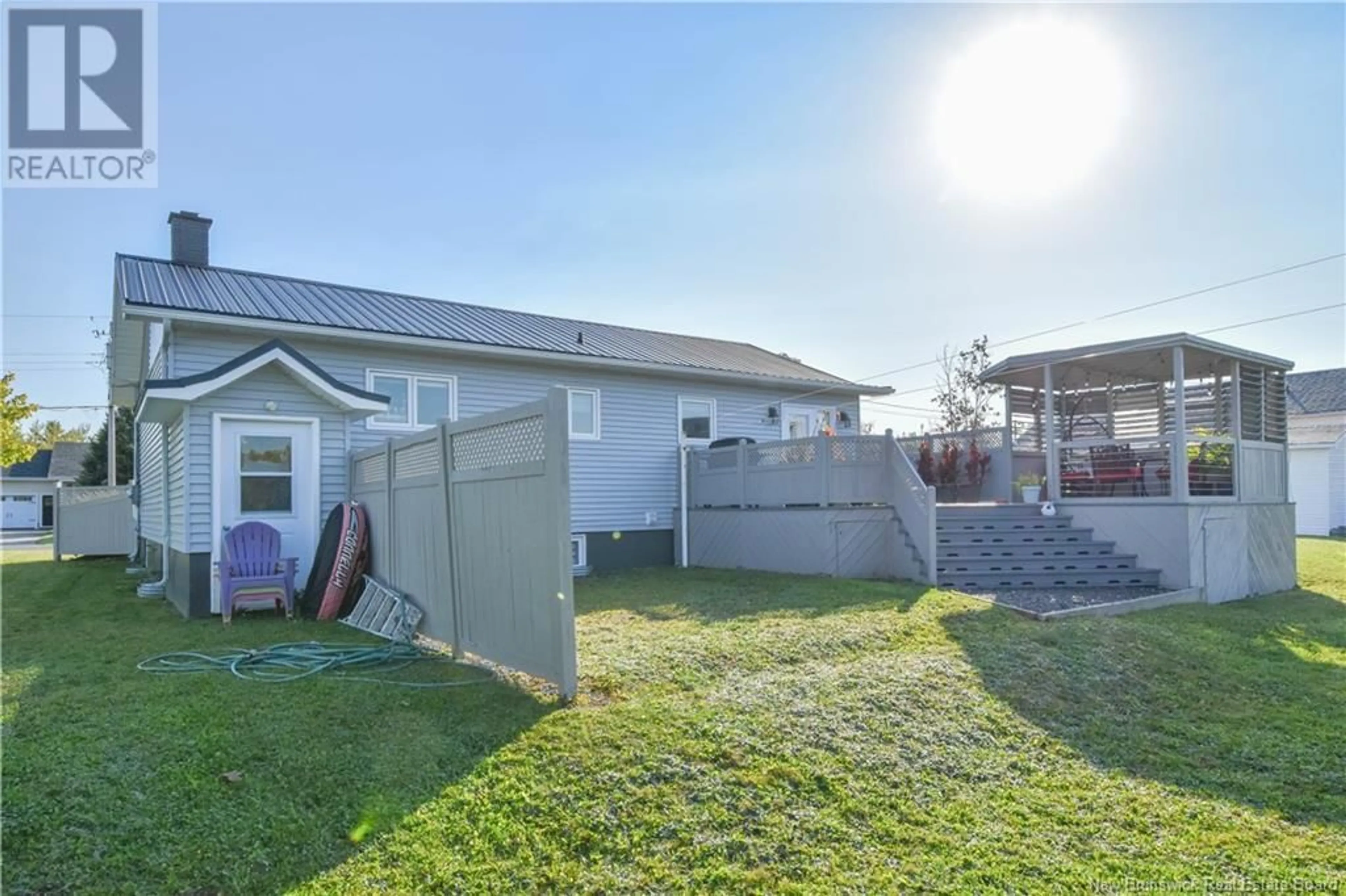 Patio, the fenced backyard for 10 Gauvin Street, Caraquet New Brunswick E1W1A3