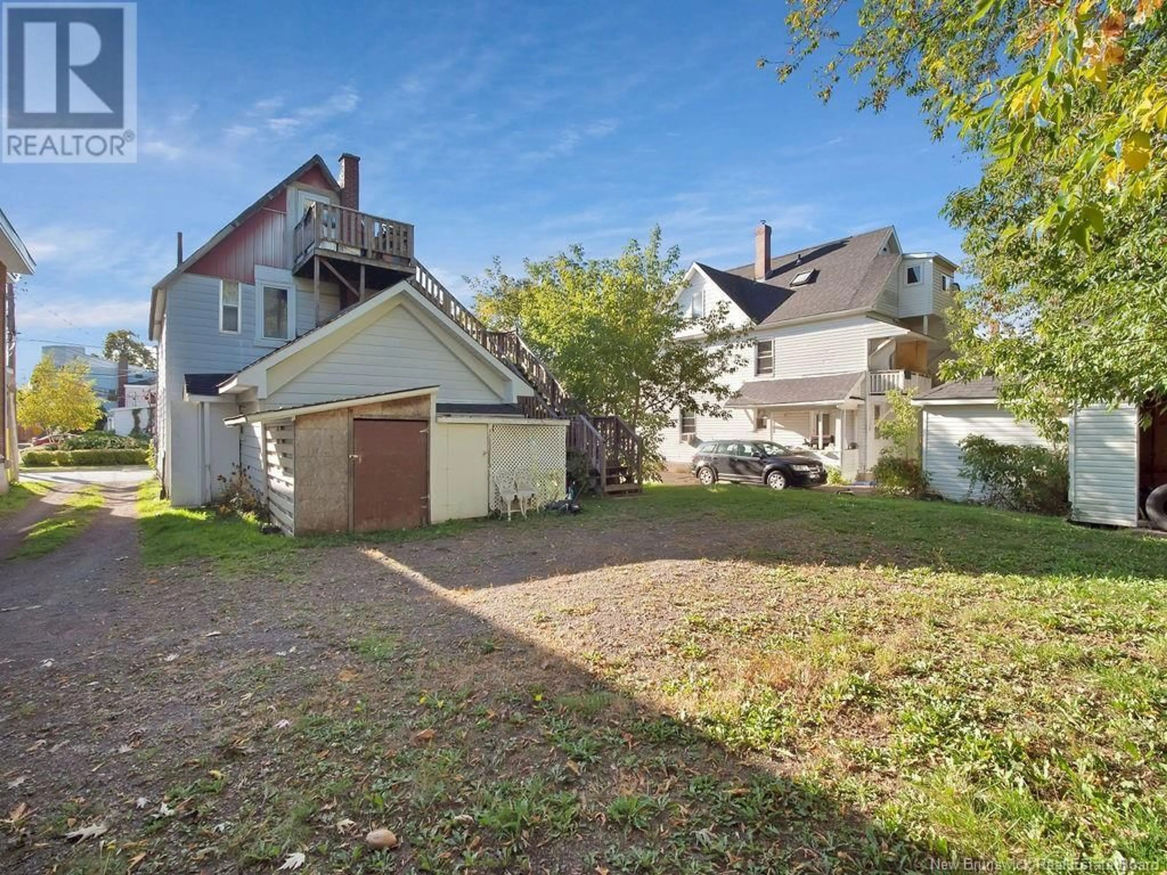 Frontside or backside of a home, the fenced backyard for 355 Lutz Street, Moncton New Brunswick E1C5H1