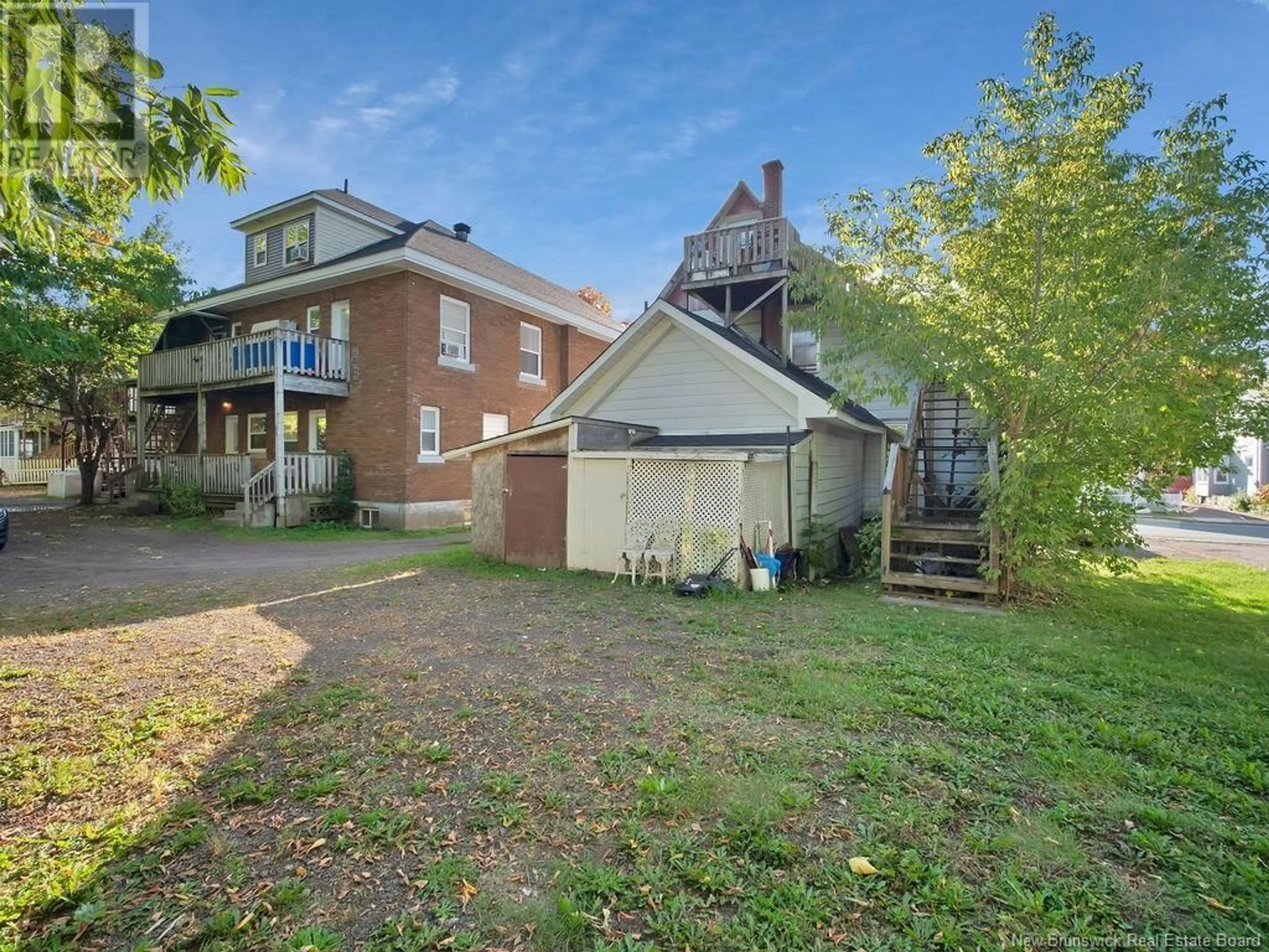 Frontside or backside of a home, the fenced backyard for 355 Lutz Street, Moncton New Brunswick E1C5H1