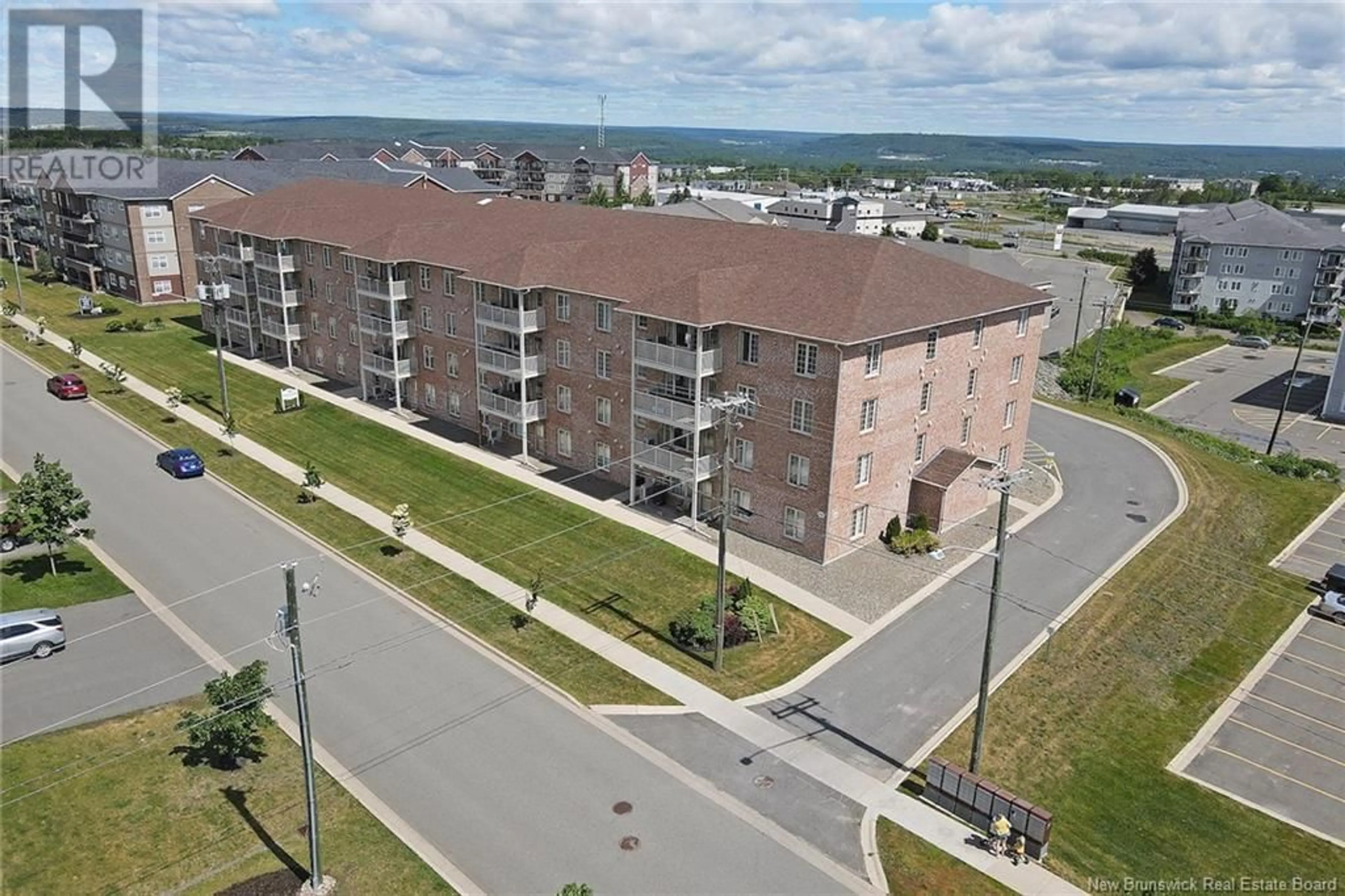 A pic from exterior of the house or condo, the front or back of building for 99 Valcour Drive Unit# 326, Fredericton New Brunswick E3C0J2