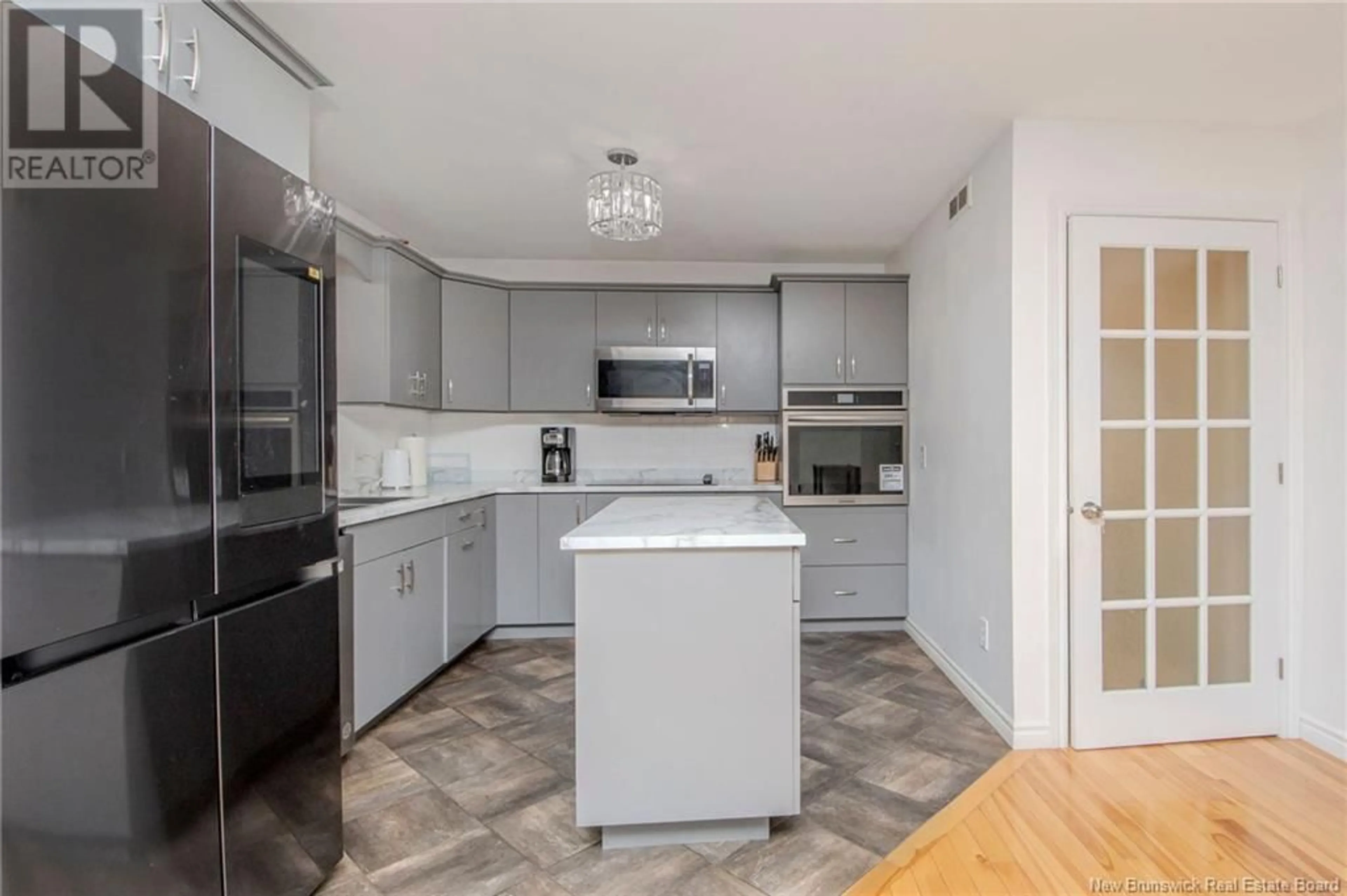 Open concept kitchen for 122 Fortune Street, Dieppe New Brunswick E1A8T8