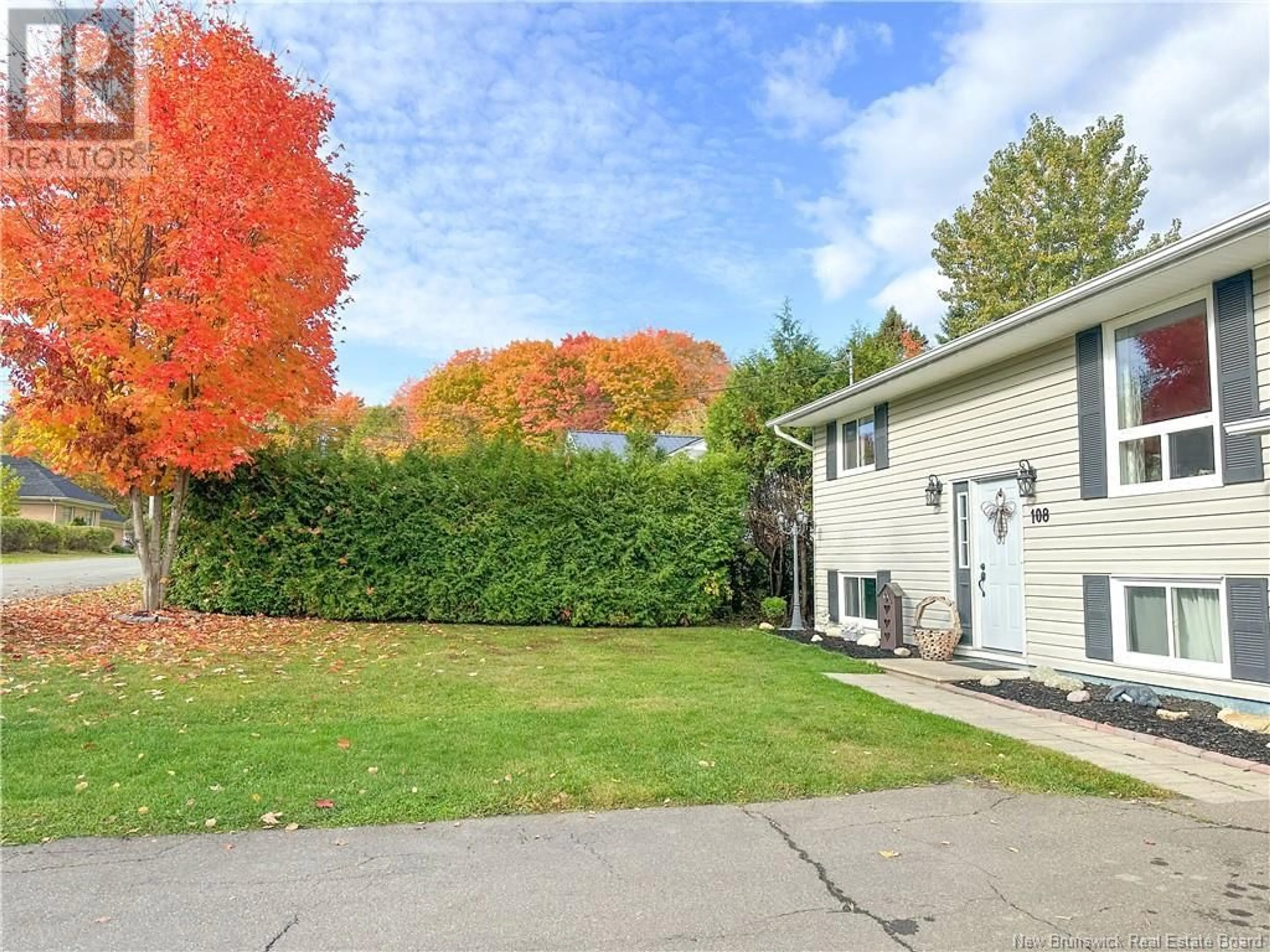 Frontside or backside of a home, the fenced backyard for 108 Stiles Street, Woodstock New Brunswick E7M2T2