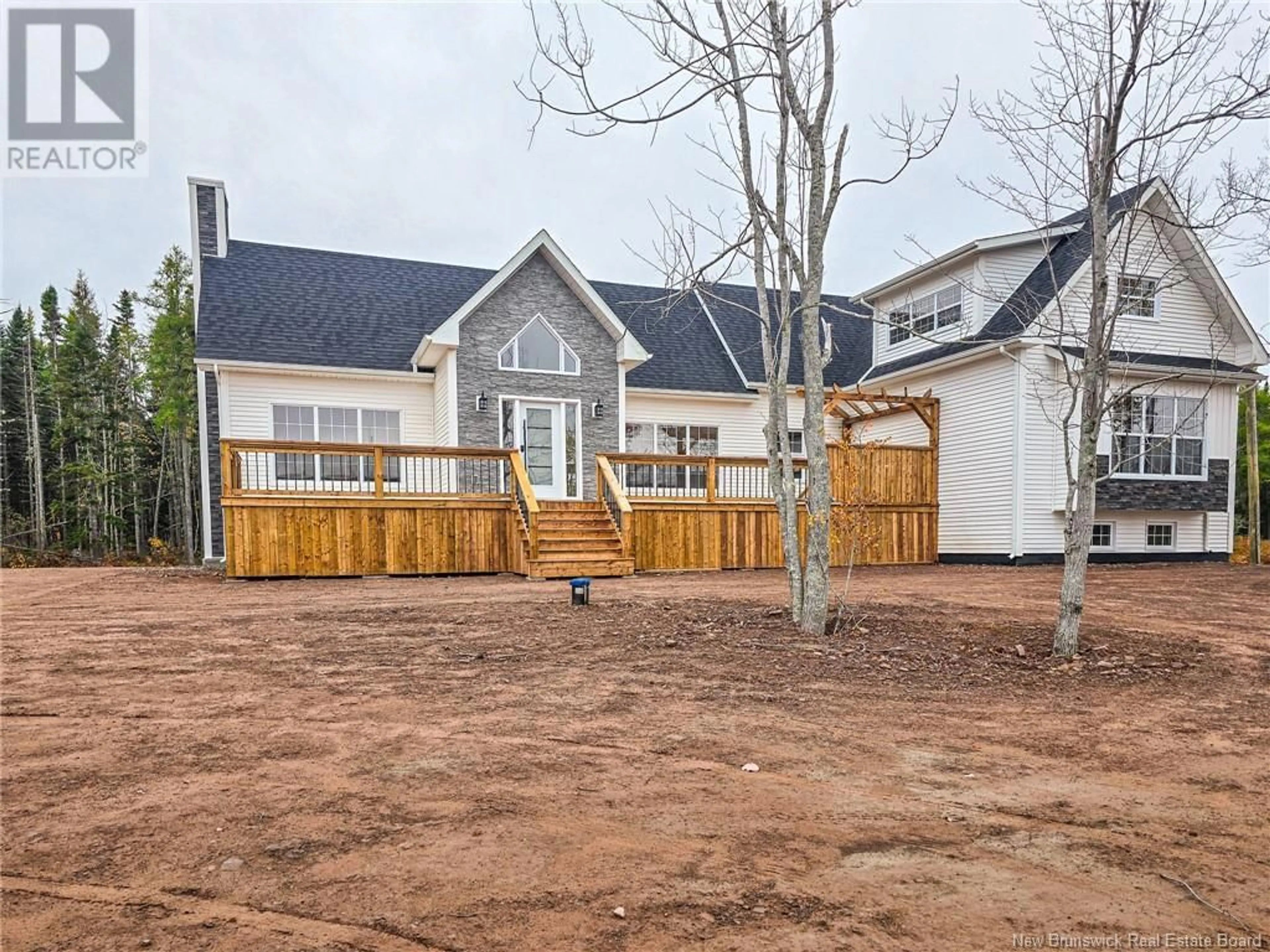 Frontside or backside of a home, the fenced backyard for 51 Justin Lane, Pokemouche New Brunswick E8P0E2