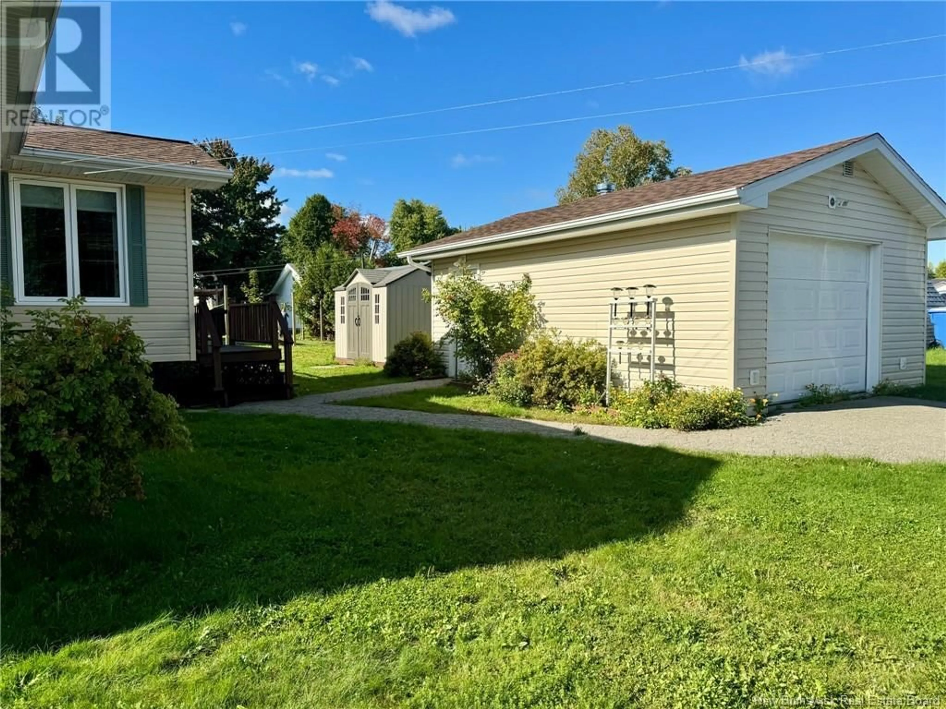 Frontside or backside of a home, the fenced backyard for 107 Ferguson Street, Miramichi New Brunswick E1V1C2