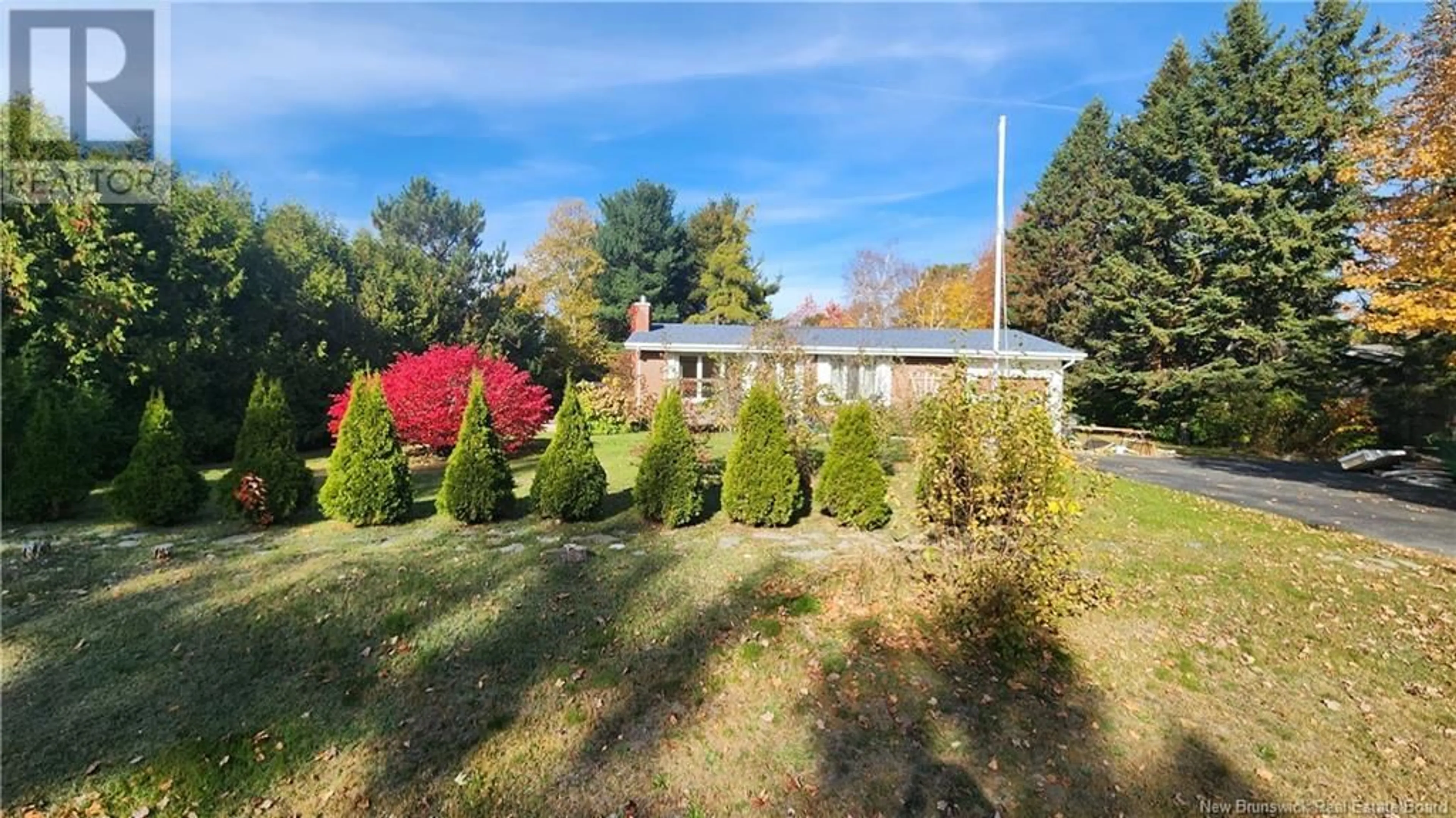 A pic from exterior of the house or condo, the fenced backyard for 603 Wellington Street, Miramichi New Brunswick E1N3M1