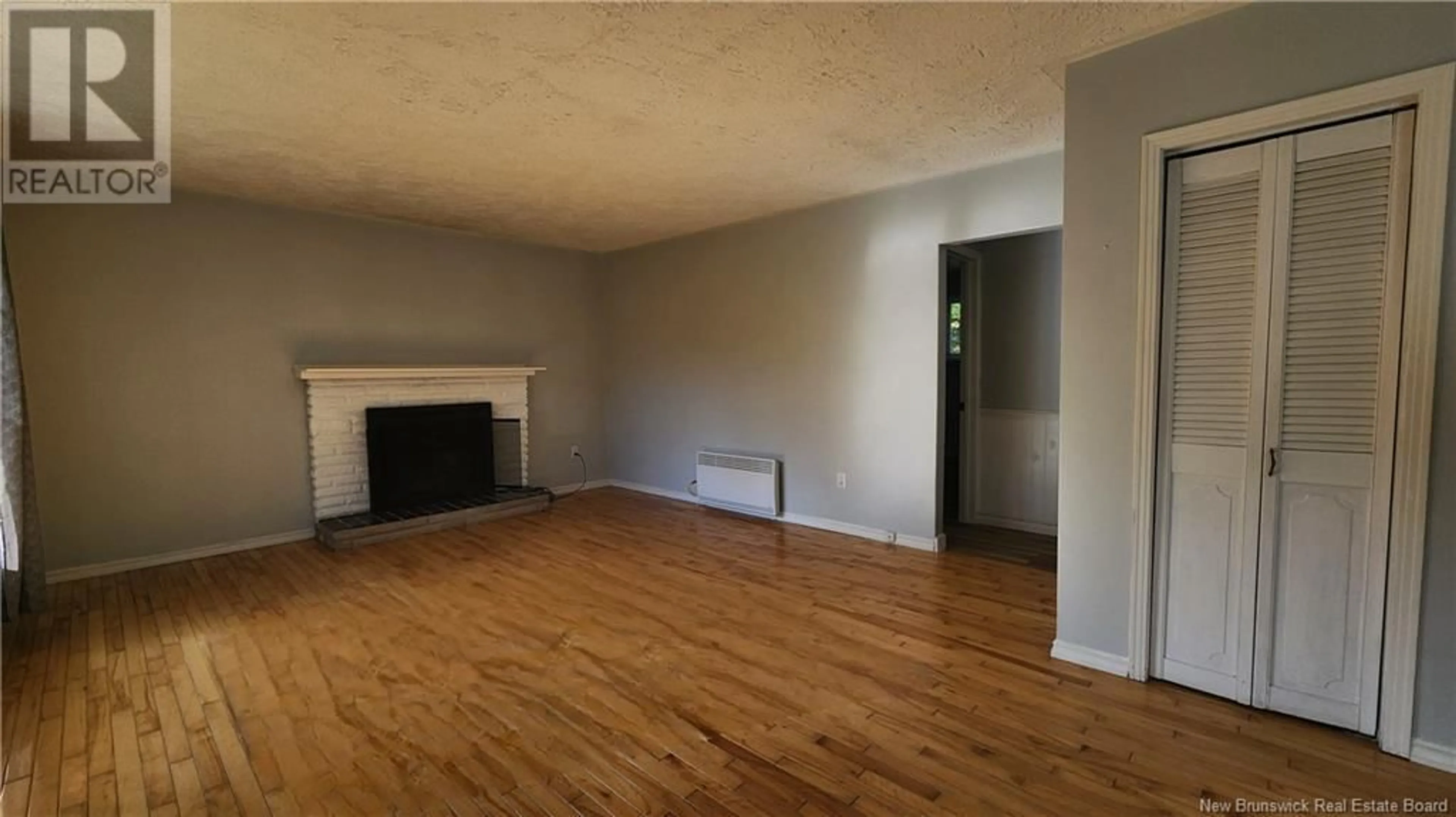 A pic of a room, wood floors for 603 Wellington Street, Miramichi New Brunswick E1N3M1