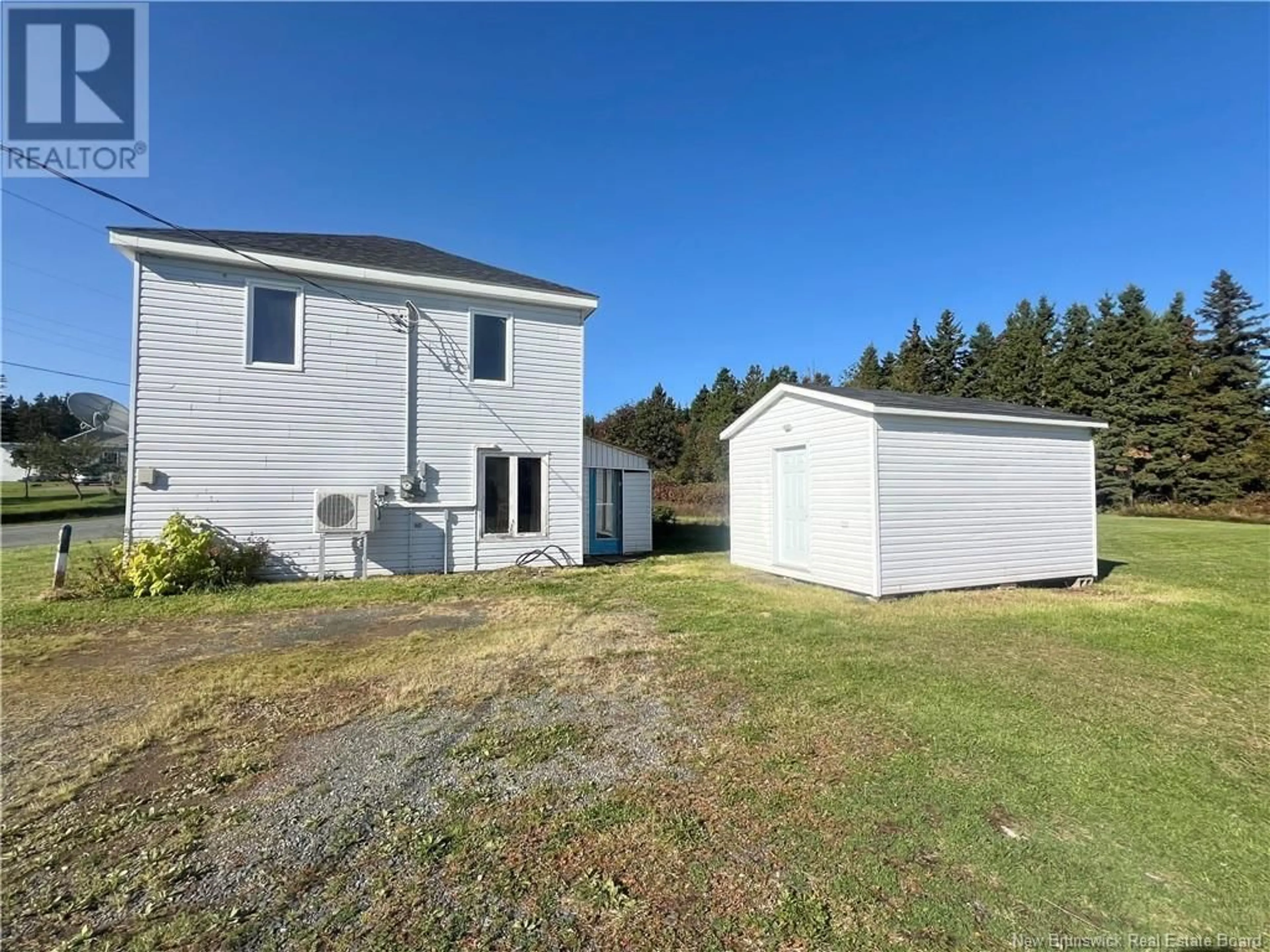 Frontside or backside of a home, the fenced backyard for 94 Rue Du Ruisseau, Pointe-Verte New Brunswick E8J2Y8