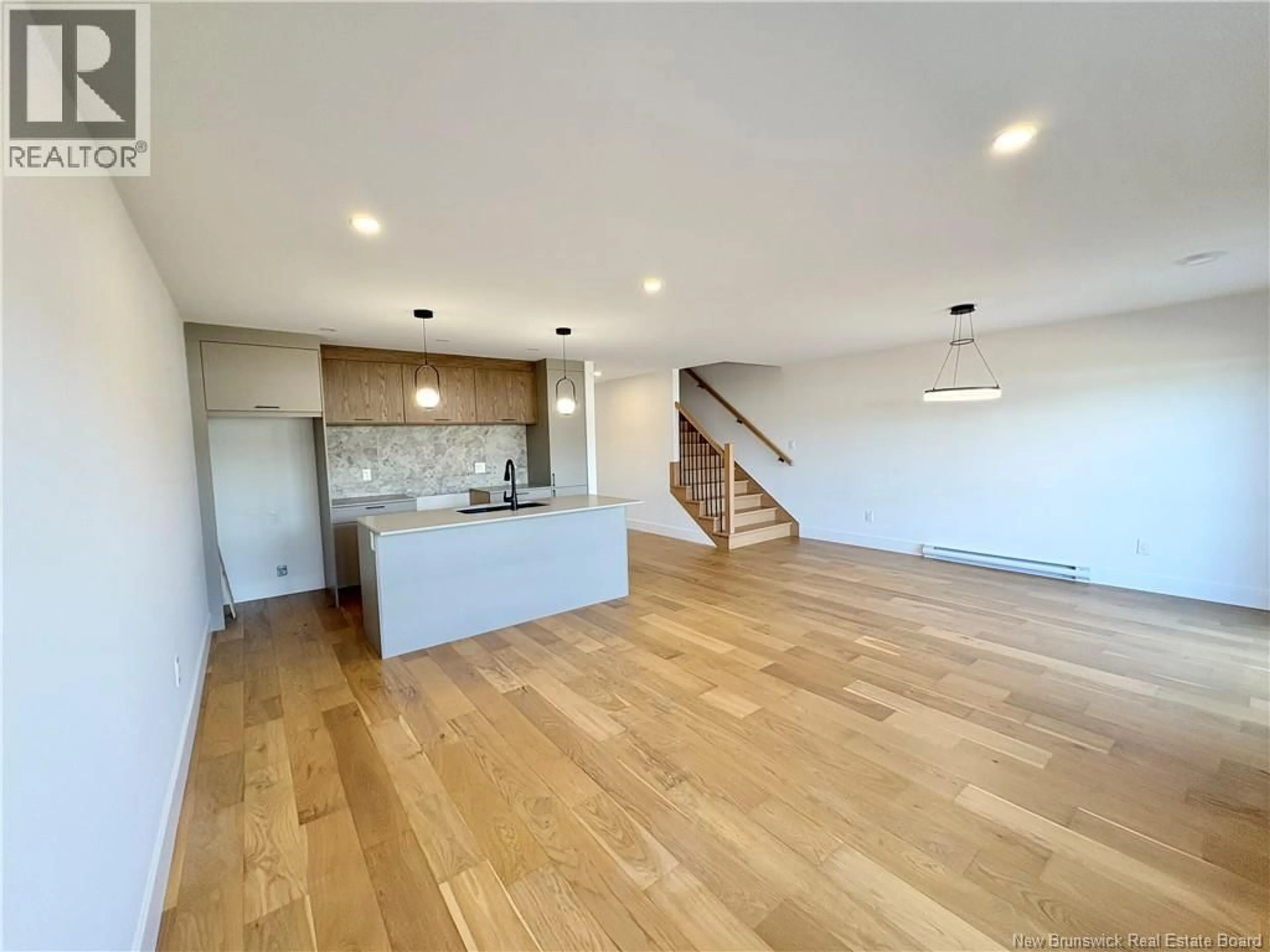 Open concept kitchen, wood/laminate floor for 214 DICKEY BOULEVARD, Riverview New Brunswick E1B4X2