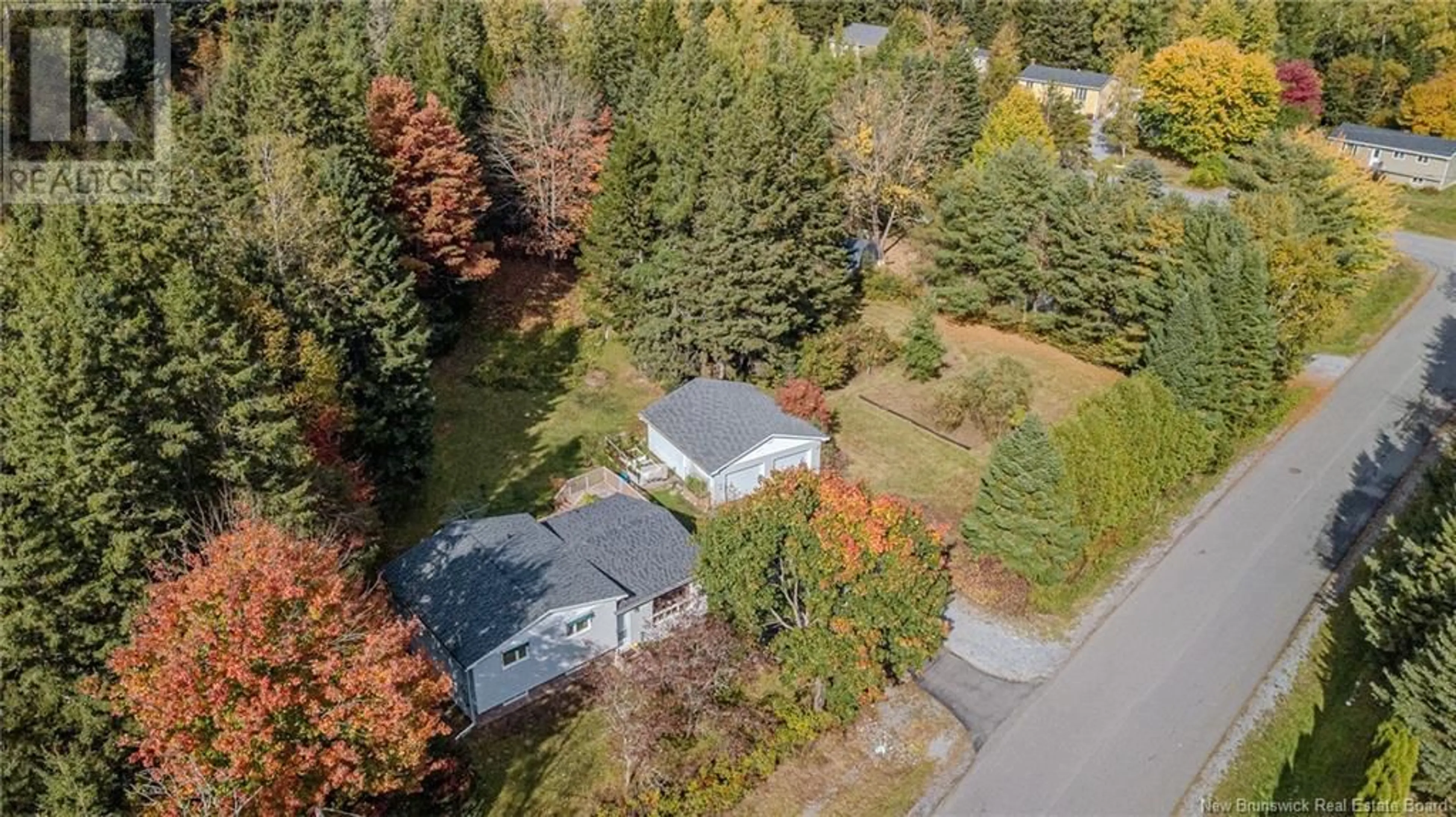 Frontside or backside of a home, the fenced backyard for 13 Wayne Court, Quispamsis New Brunswick E2G1E6