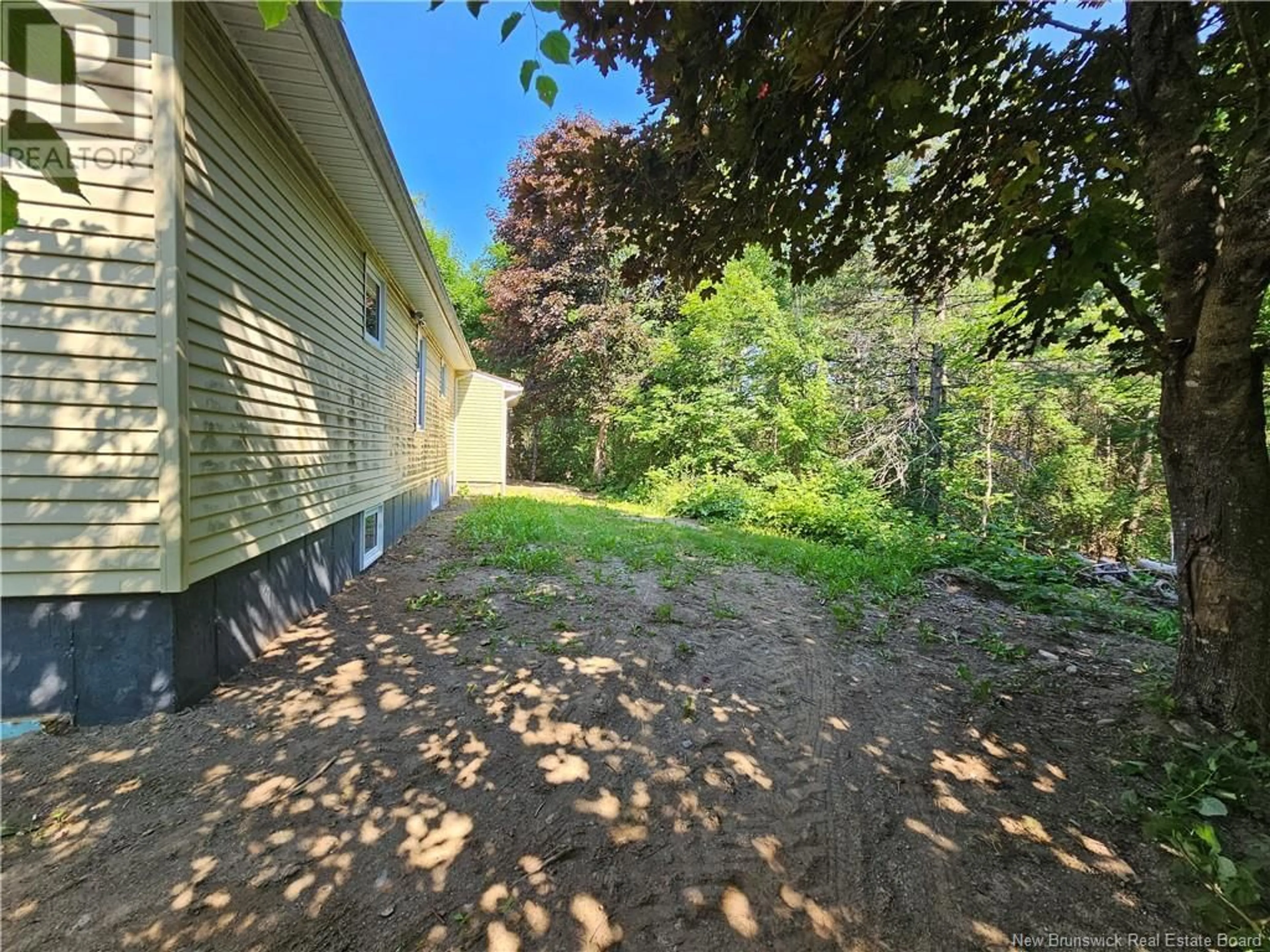 Frontside or backside of a home, the fenced backyard for 65 Church Street, Milltown New Brunswick E3L1M6