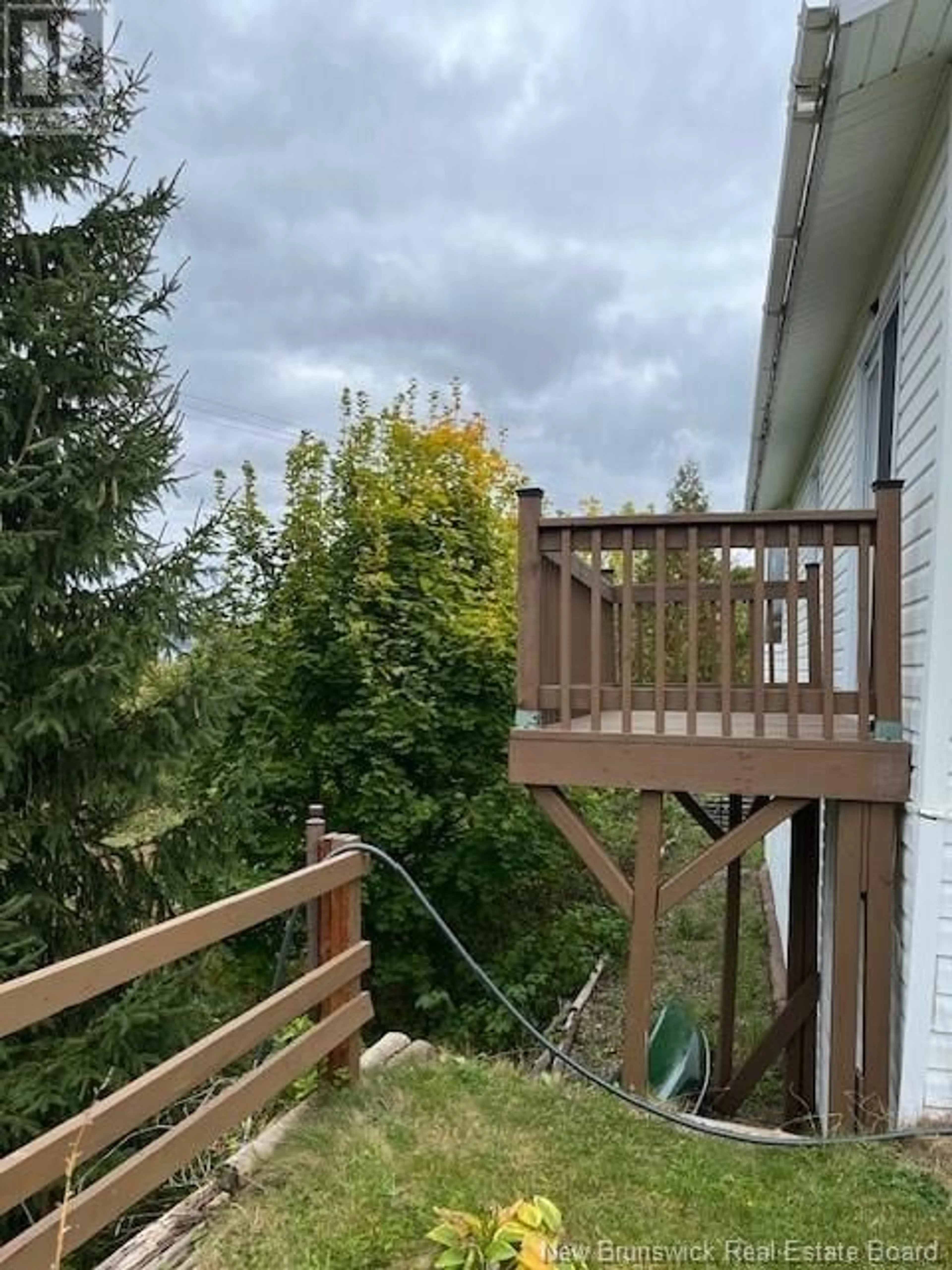 Frontside or backside of a home, the fenced backyard for 103 Lavigne Lane, Dalhousie New Brunswick E8C1Z1