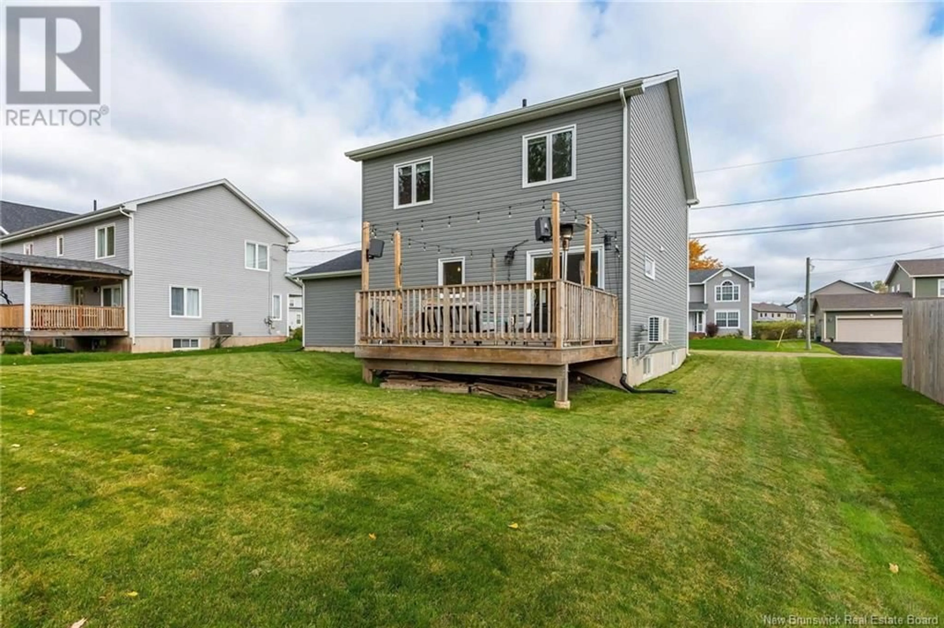 Frontside or backside of a home, the fenced backyard for 10 Shad Court, Moncton New Brunswick E1G0Z1