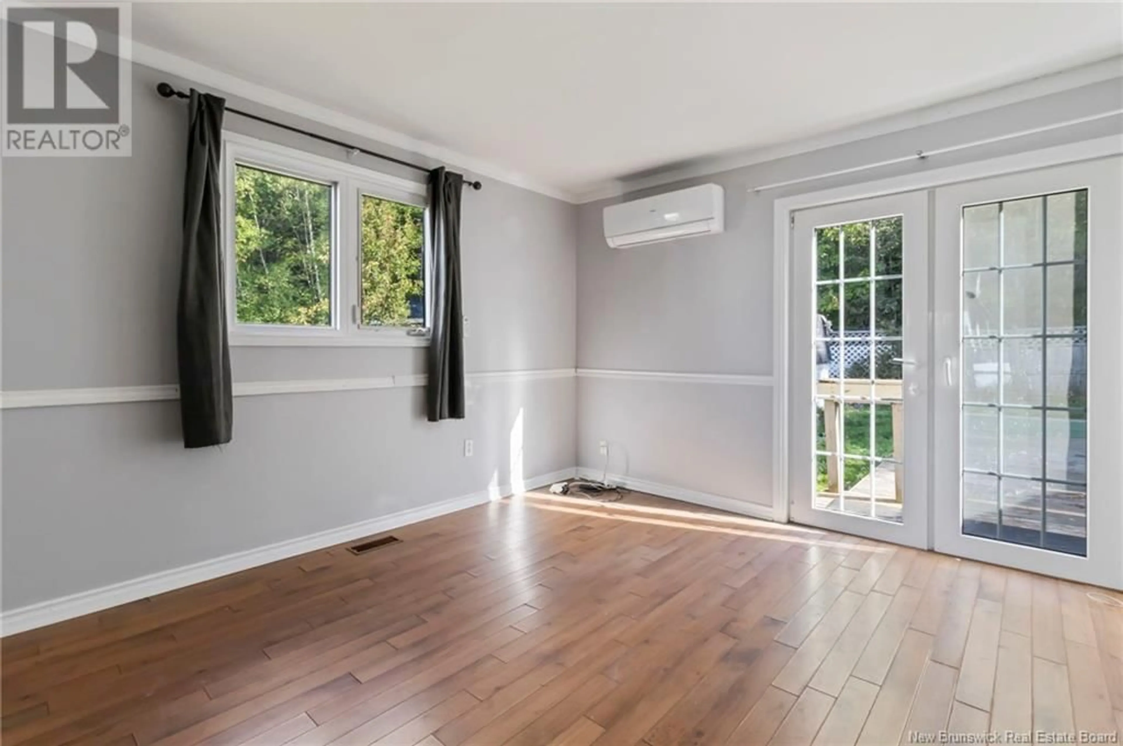 A pic of a room, wood floors for 29 Devonshire Court, Moncton New Brunswick E1E2M6