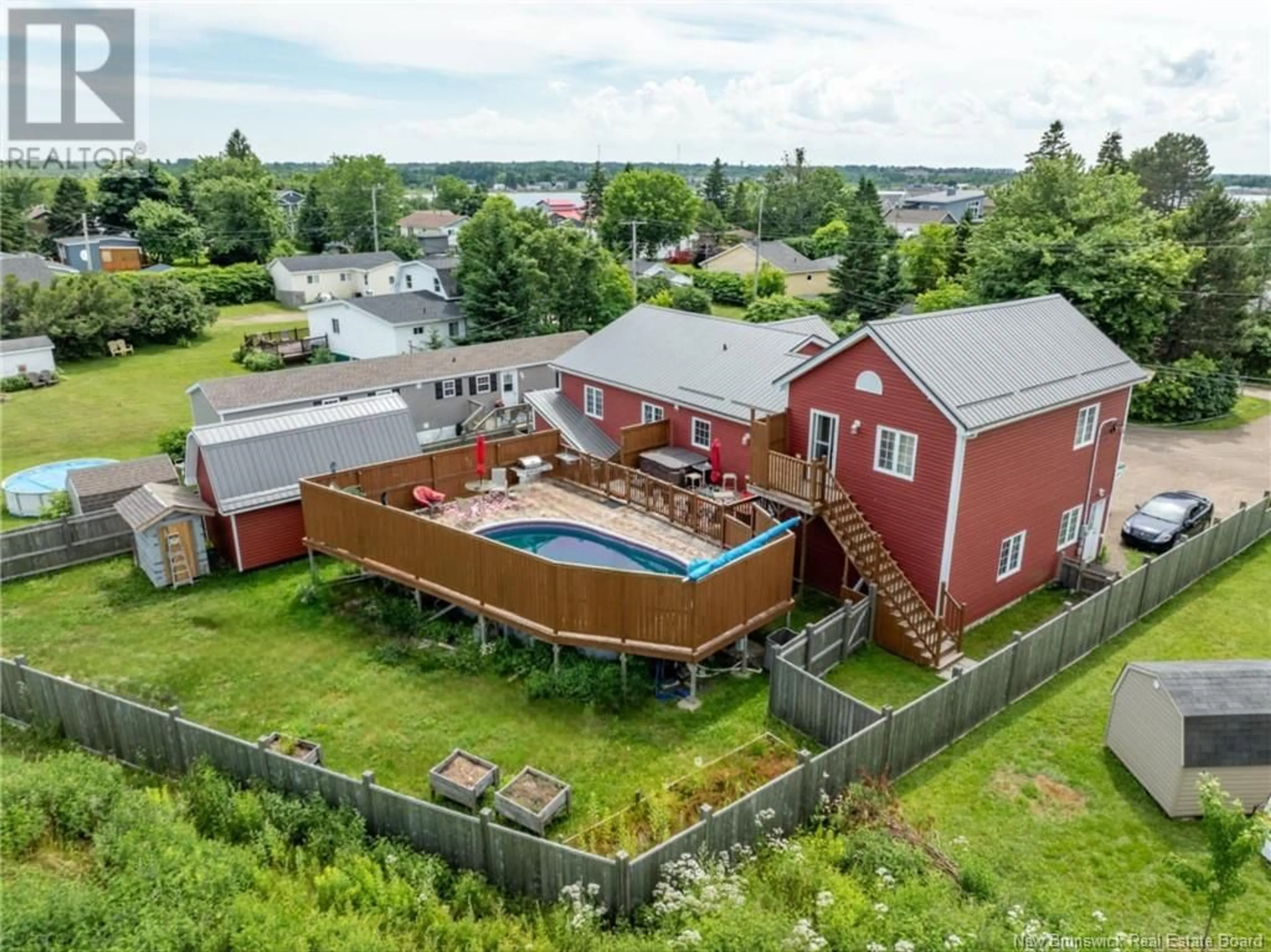 Frontside or backside of a home, the fenced backyard for 28 Glebe Avenue, Pointe-Du-Chêne New Brunswick E4P4J6