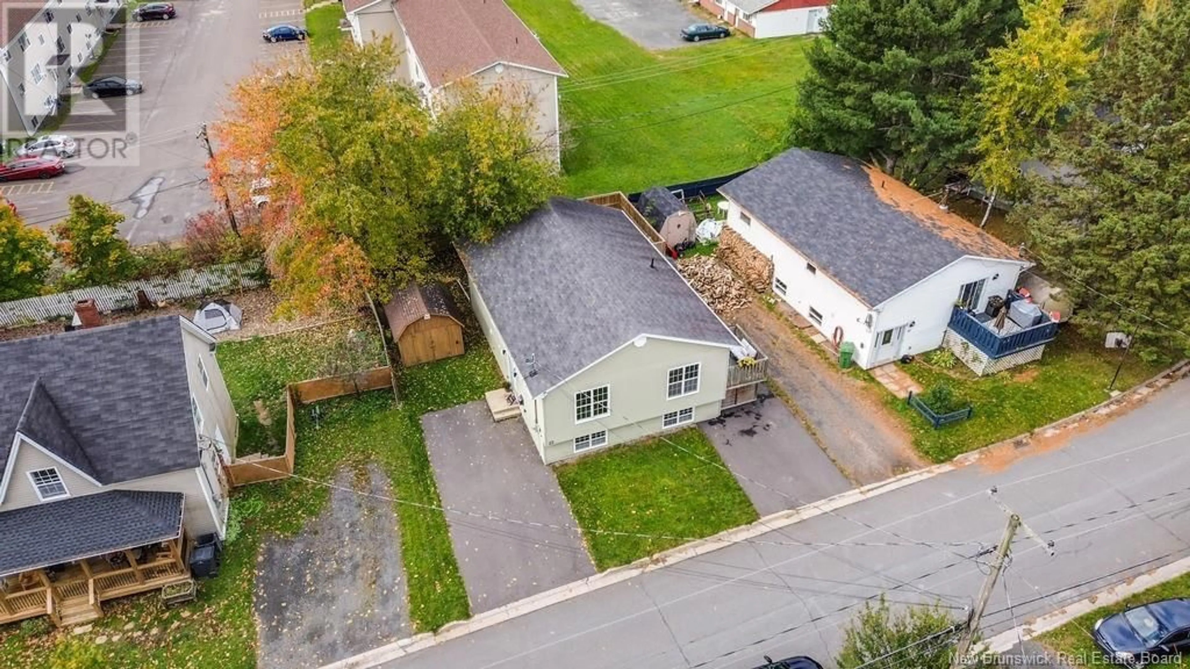 Frontside or backside of a home, the fenced backyard for 23 Ramsay Street, Fredericton New Brunswick E3A4B3