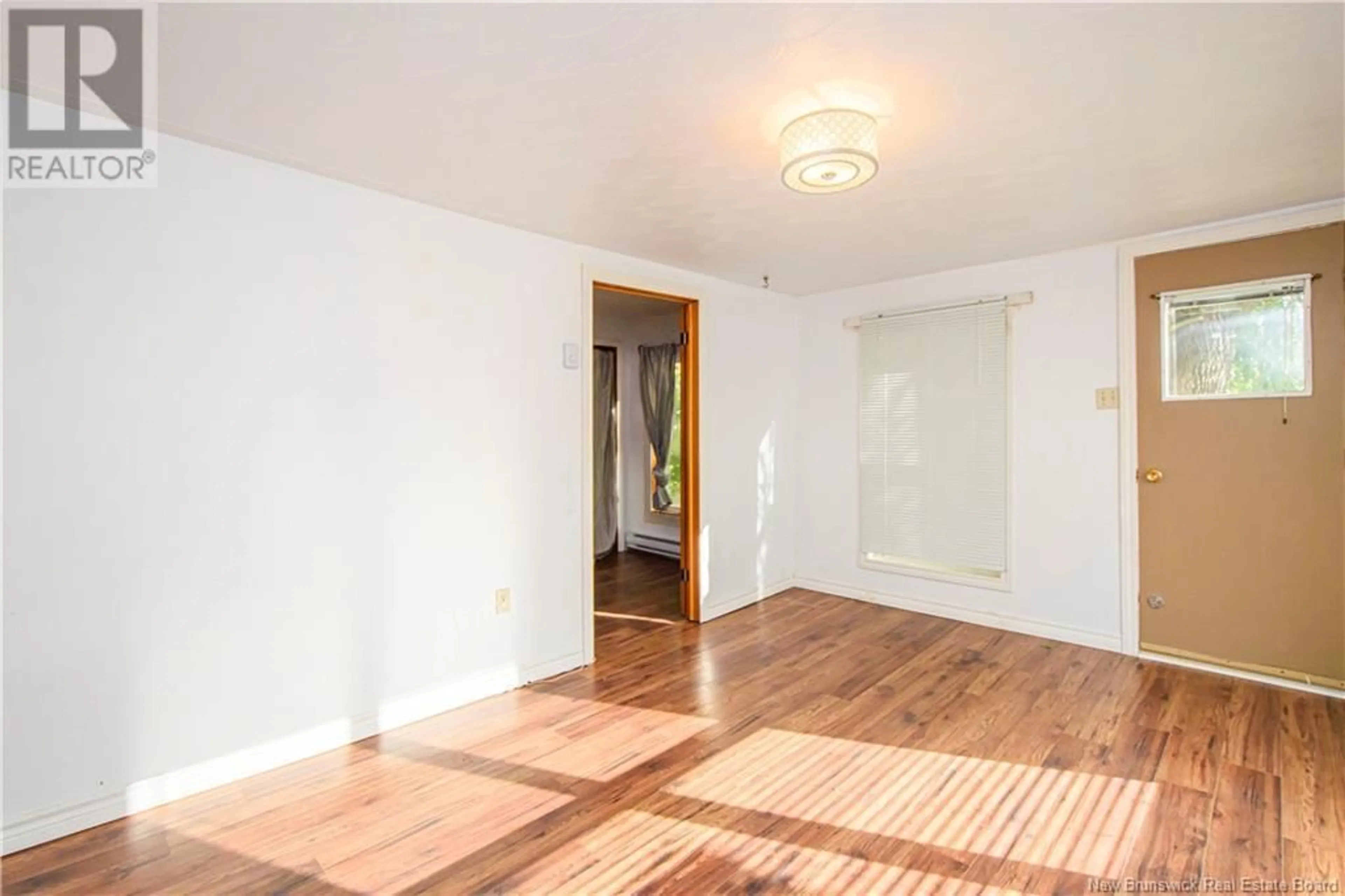 A pic of a room, wood floors for 19 Dunham Road, Pointe-Du-Chêne New Brunswick E4P4C6