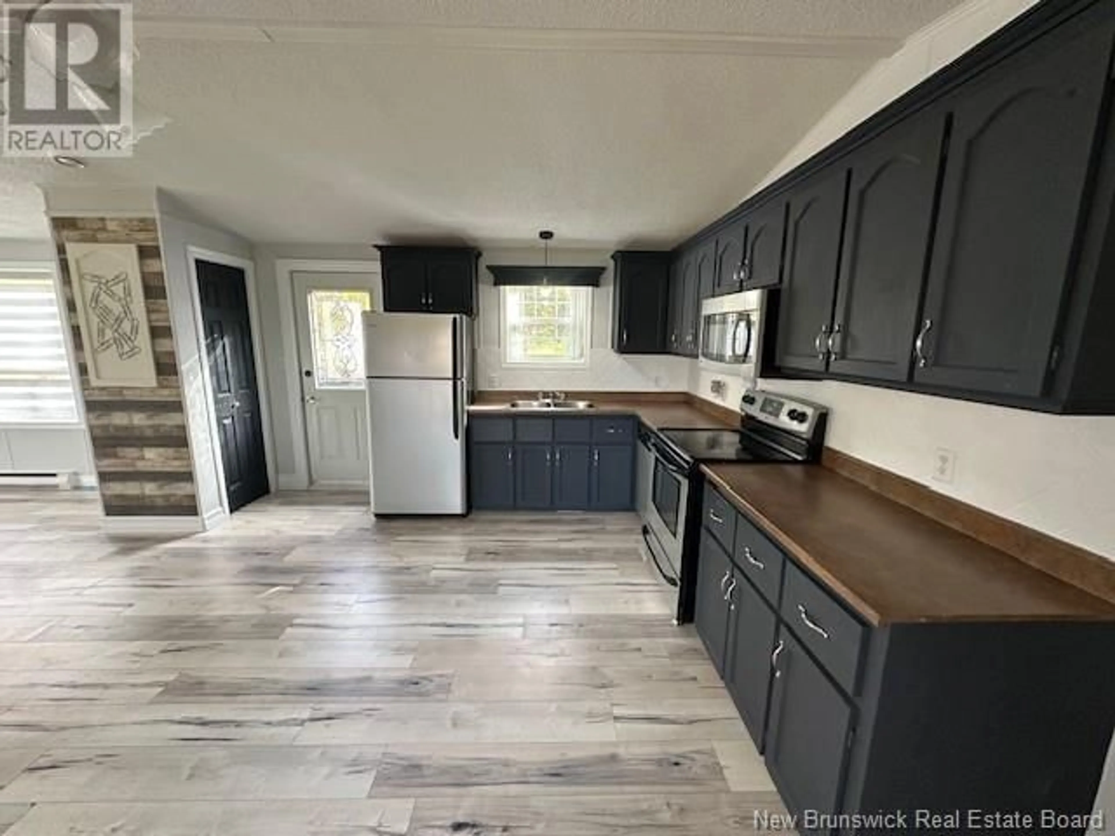 Open concept kitchen for 20 Maple Green Crescent, Dalhousie Junction New Brunswick E3N5Z3