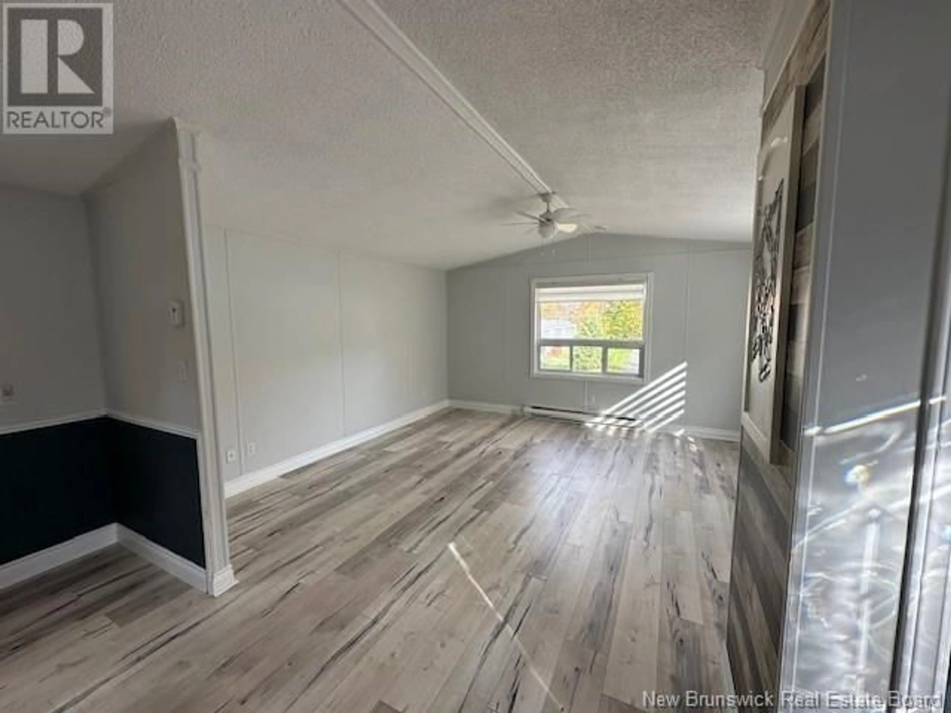 A pic of a room, wood floors for 20 Maple Green Crescent, Dalhousie Junction New Brunswick E3N5Z3