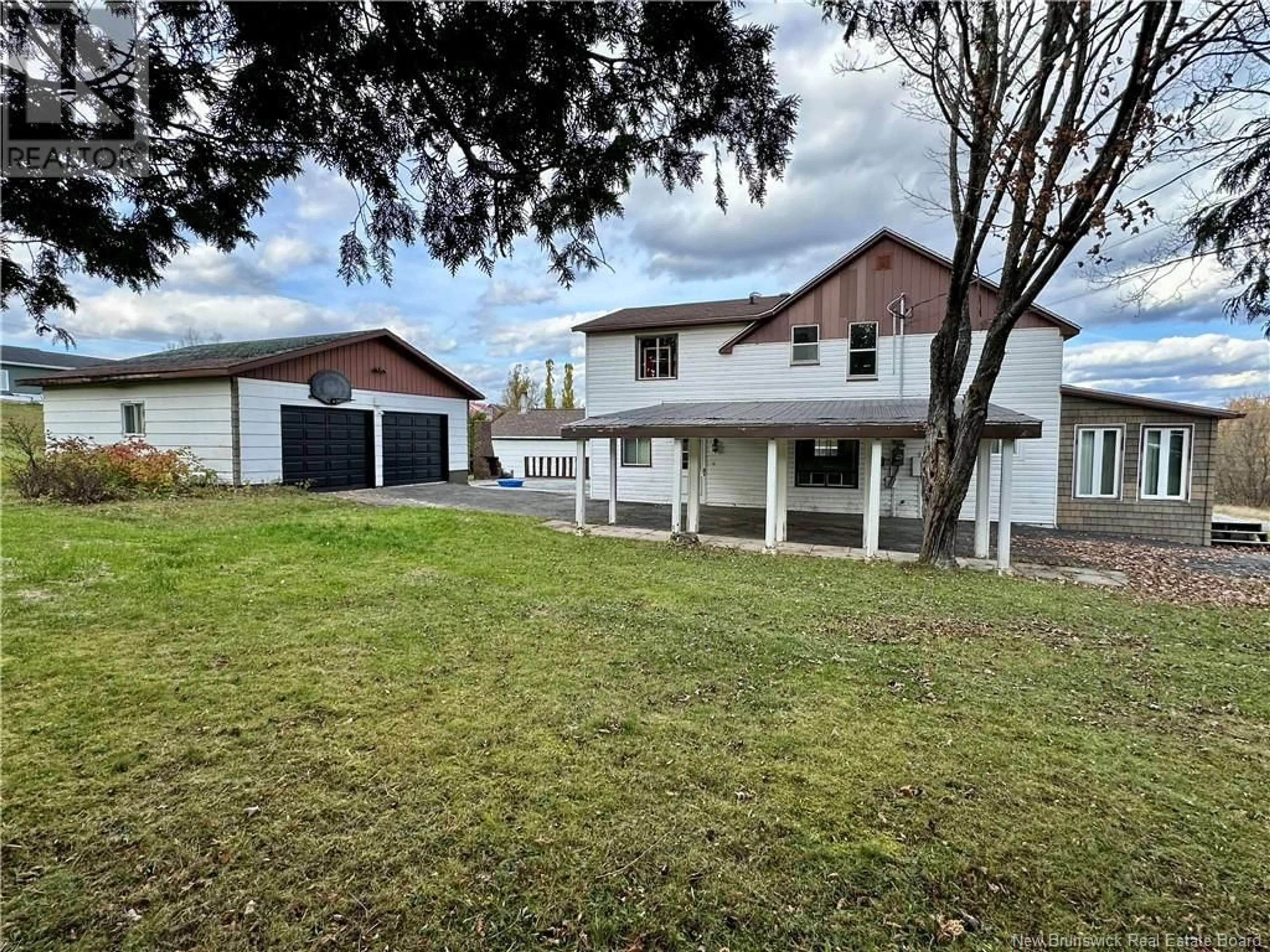 Frontside or backside of a home, the fenced backyard for 33 Roulston Avenue, Plaster Rock New Brunswick E7G2R3