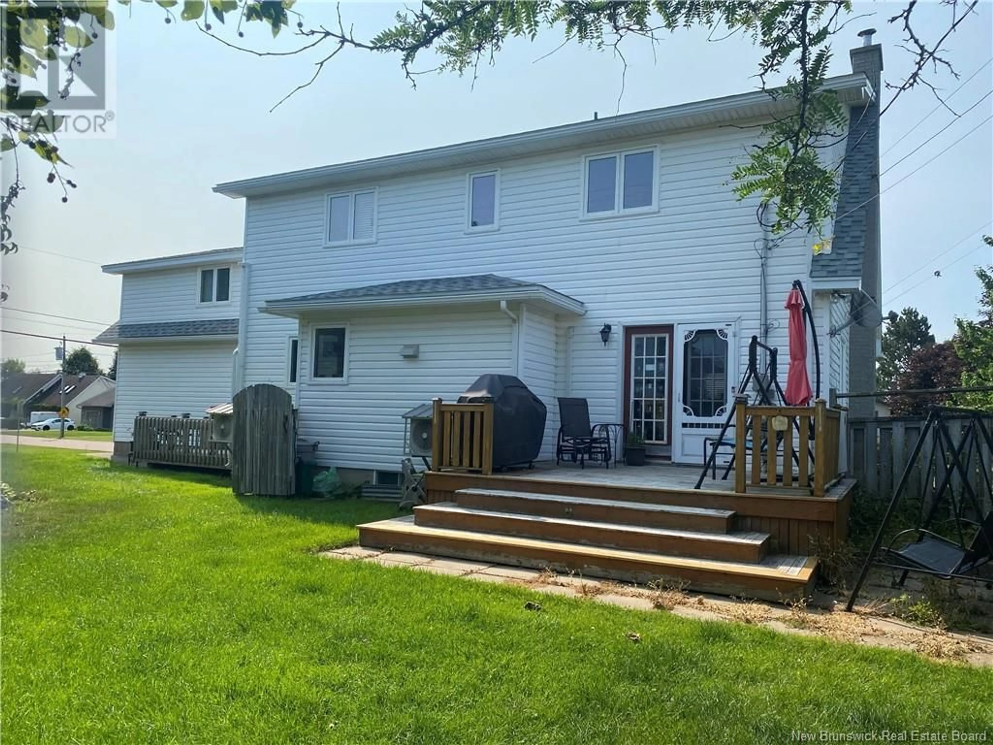 Frontside or backside of a home, the fenced backyard for 293 Gaspe Street, Dieppe New Brunswick E1A6S3