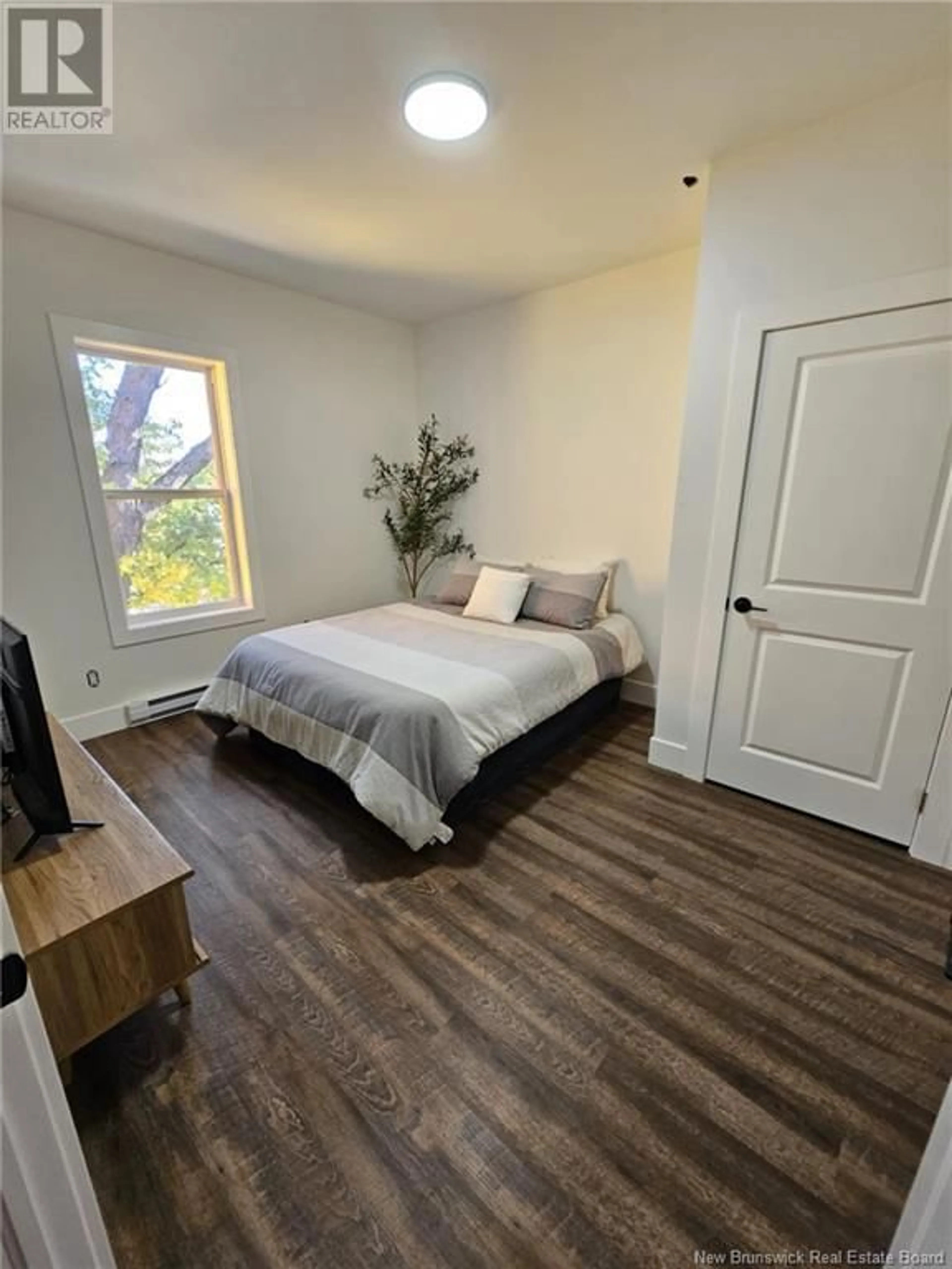 A pic of a room, wood floors for 46 Edward Street, Moncton New Brunswick E1A3Y7