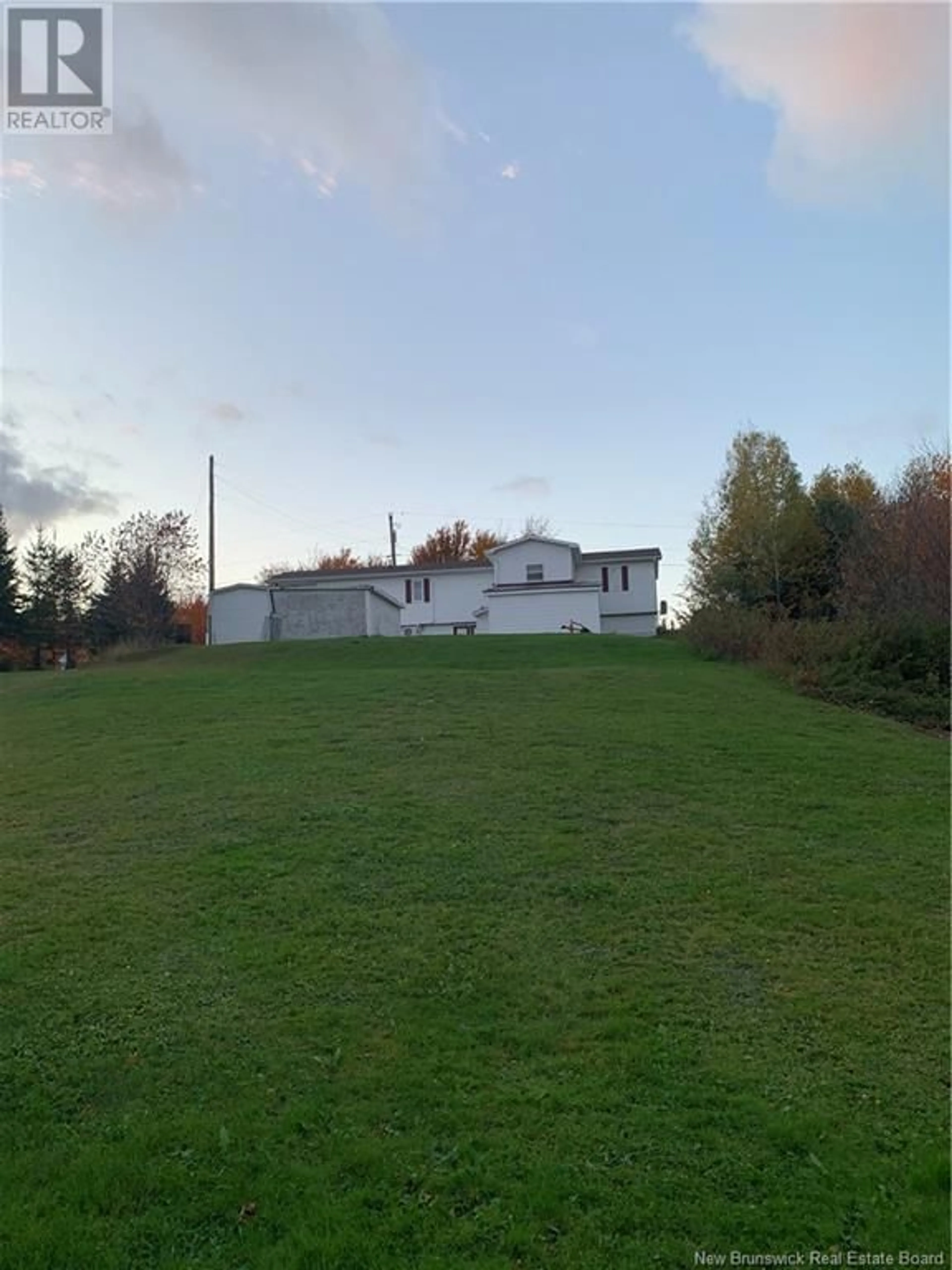 Frontside or backside of a home, the fenced backyard for 1145 Tweedie Brook Road, Kouchibouguac New Brunswick E4X1M5