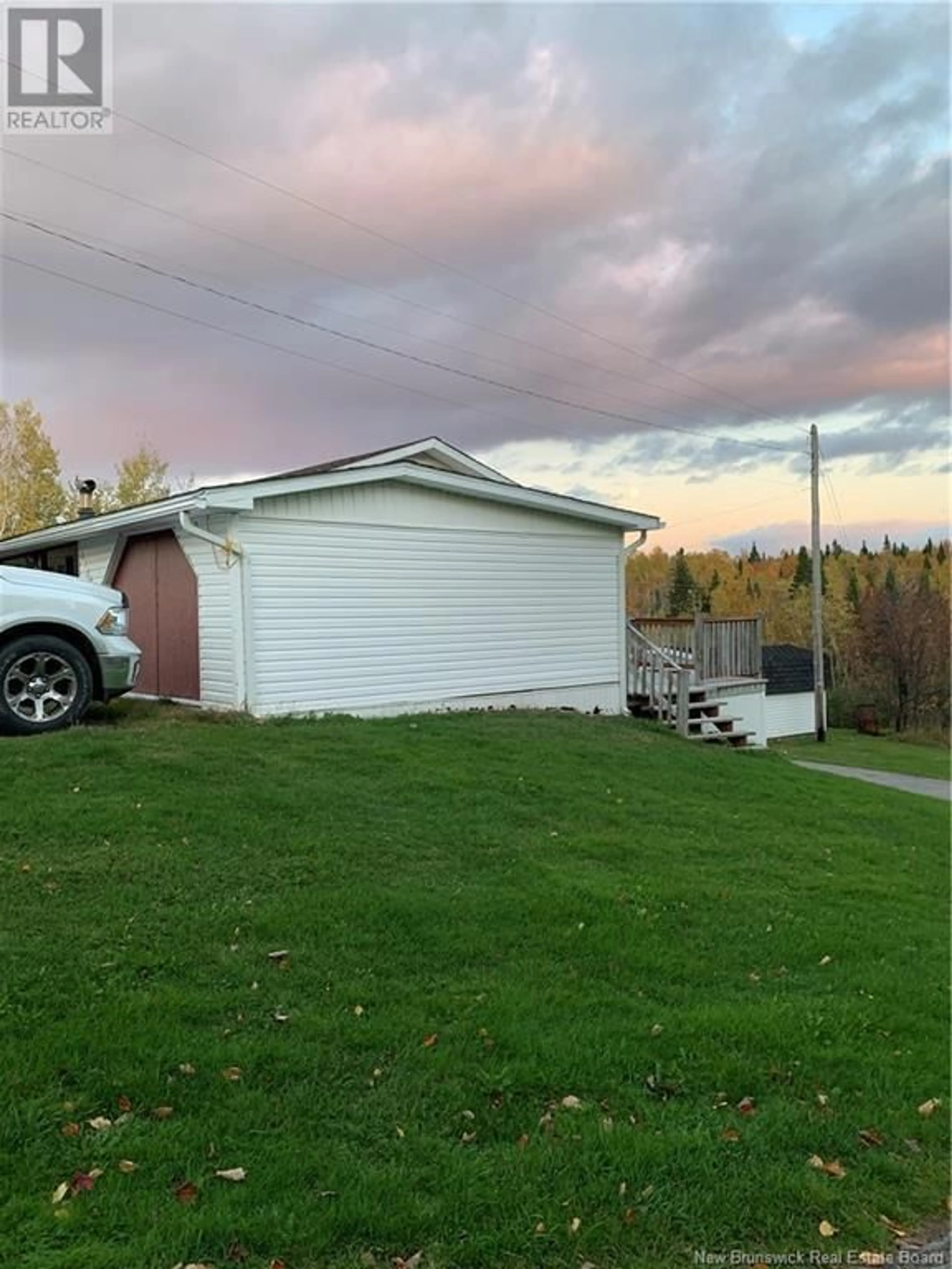 A pic from exterior of the house or condo, the fenced backyard for 1145 Tweedie Brook Road, Kouchibouguac New Brunswick E4X1M5