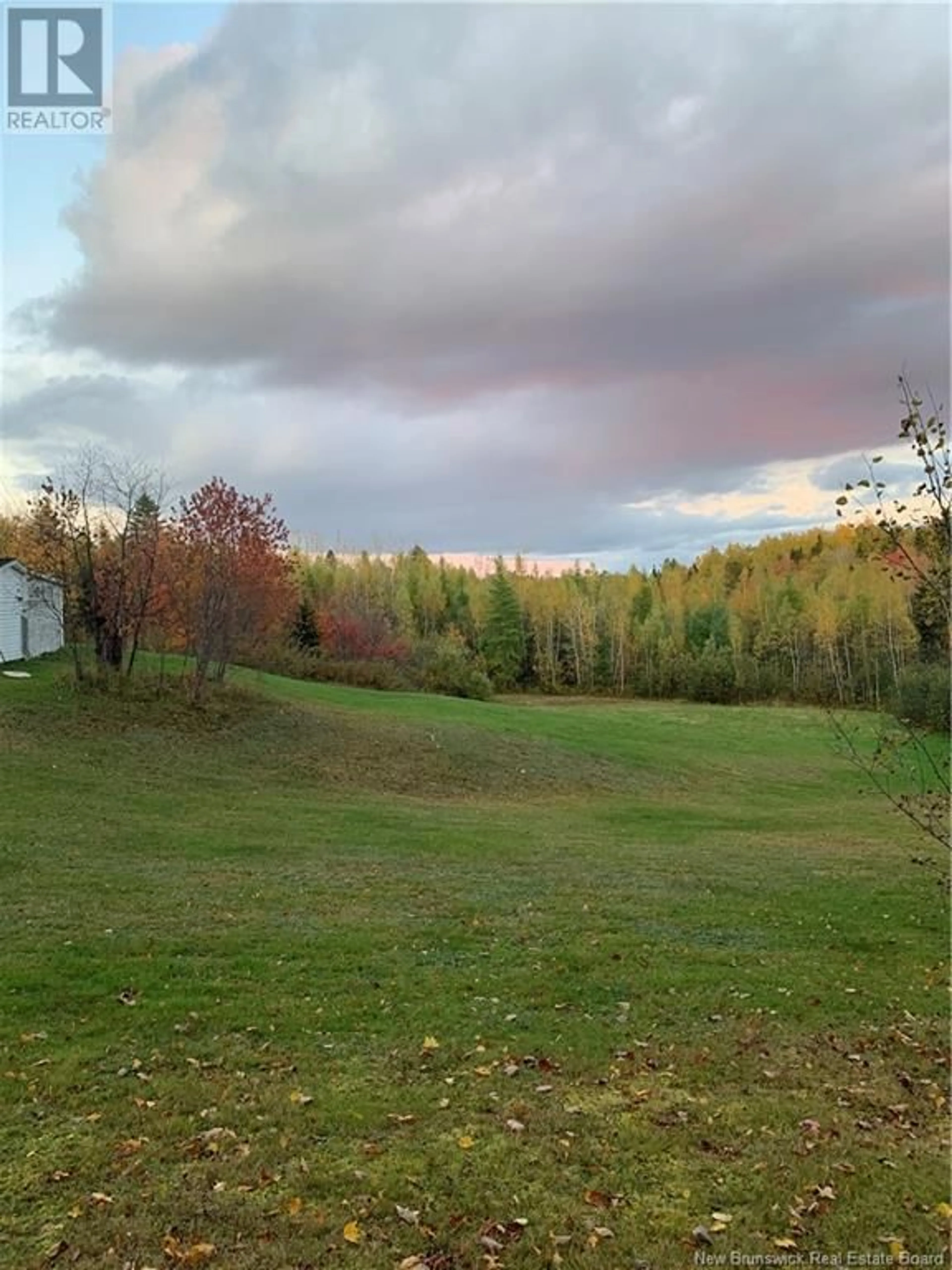 A pic from exterior of the house or condo, the fenced backyard for 1145 Tweedie Brook Road, Kouchibouguac New Brunswick E4X1M5