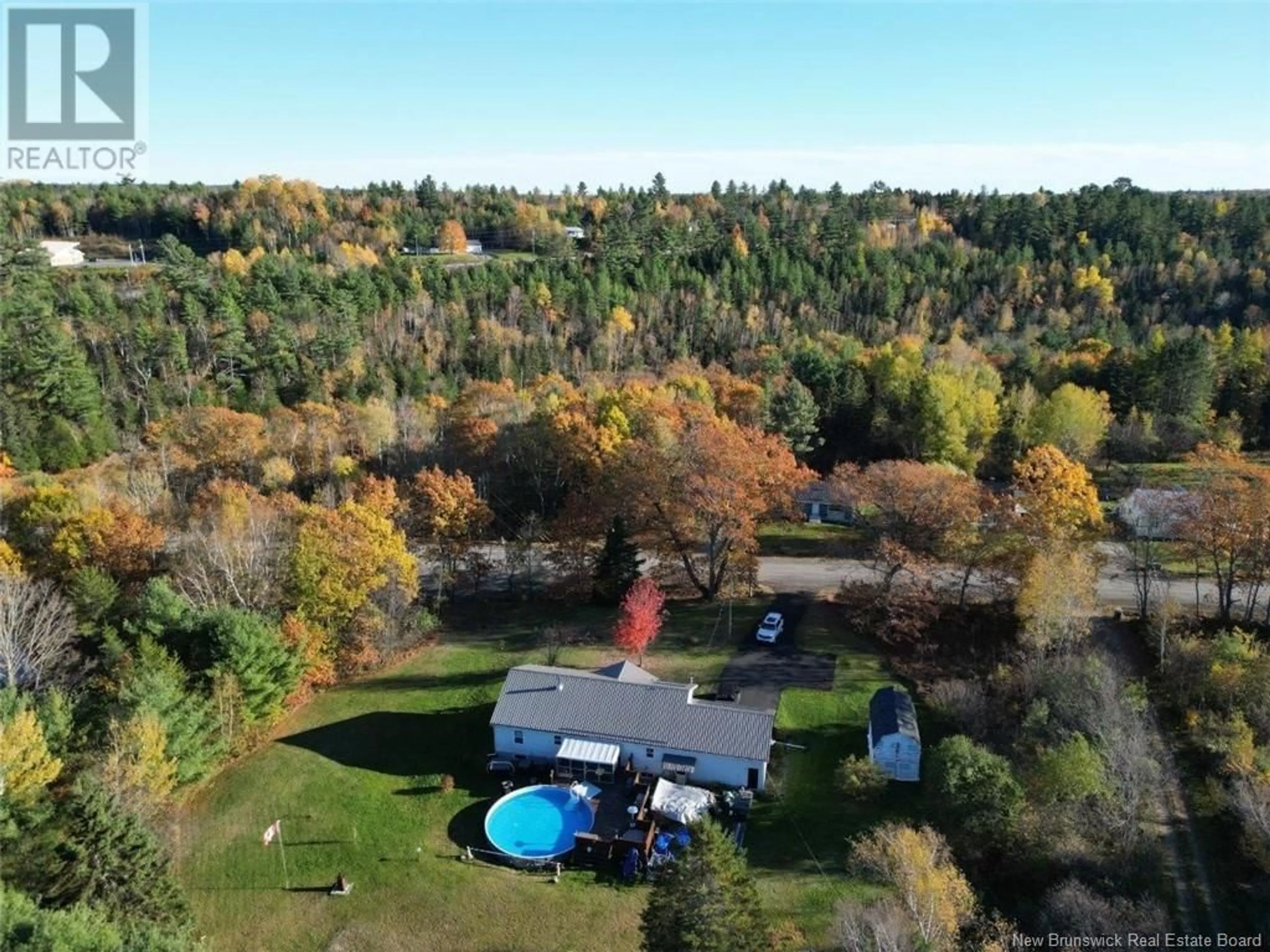 A pic from exterior of the house or condo, the fenced backyard for 3537 Route 625, Boiestown New Brunswick E6A1C4