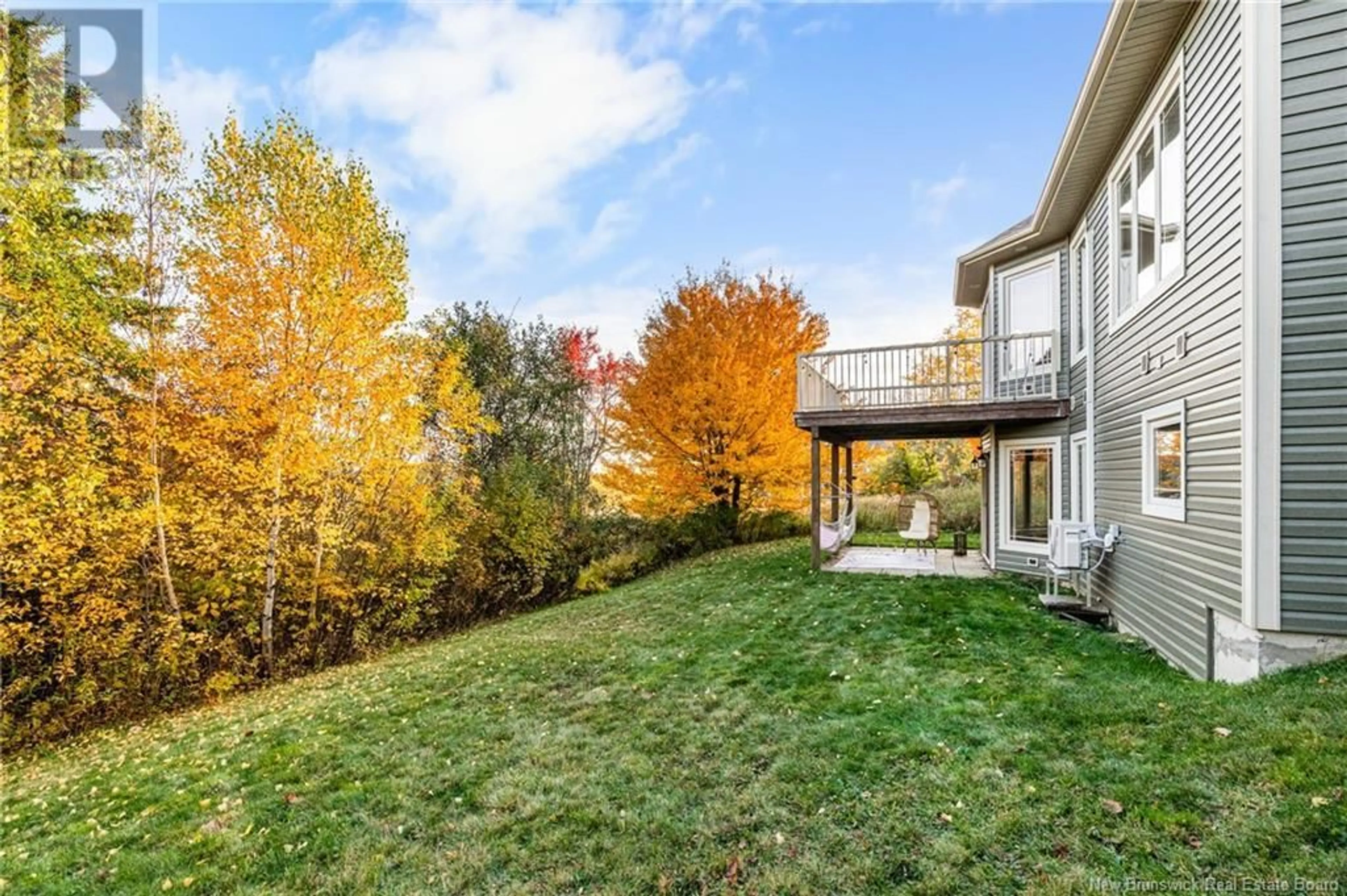 A pic from exterior of the house or condo, the fenced backyard for 35 Heron Court, Bouctouche New Brunswick E4S0E3