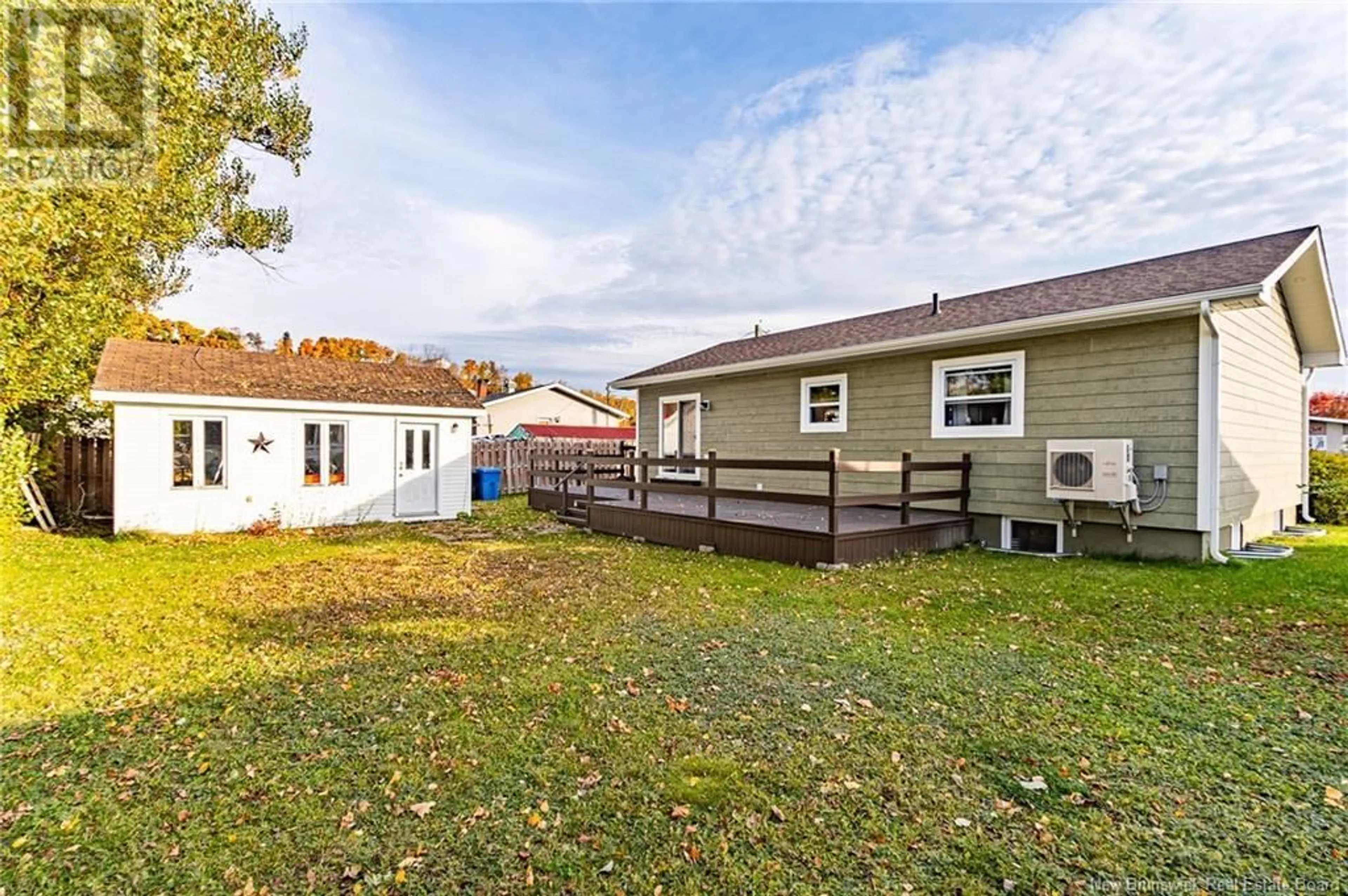 Frontside or backside of a home, the fenced backyard for 11 Walsh Avenue, Campbellton New Brunswick E3N2C9