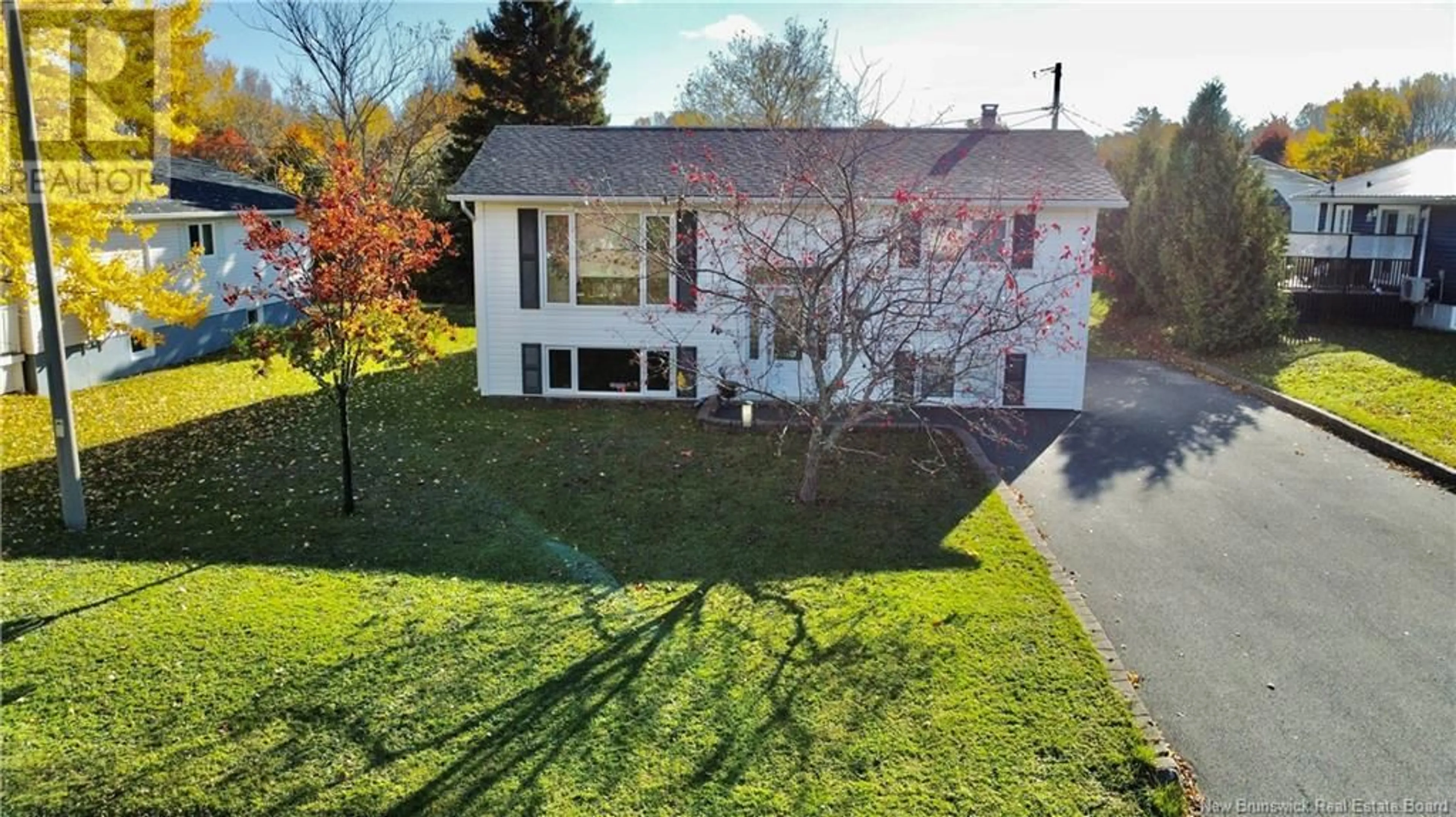 Frontside or backside of a home, the fenced backyard for 1991 Hinton, Bathurst New Brunswick E2A4G3