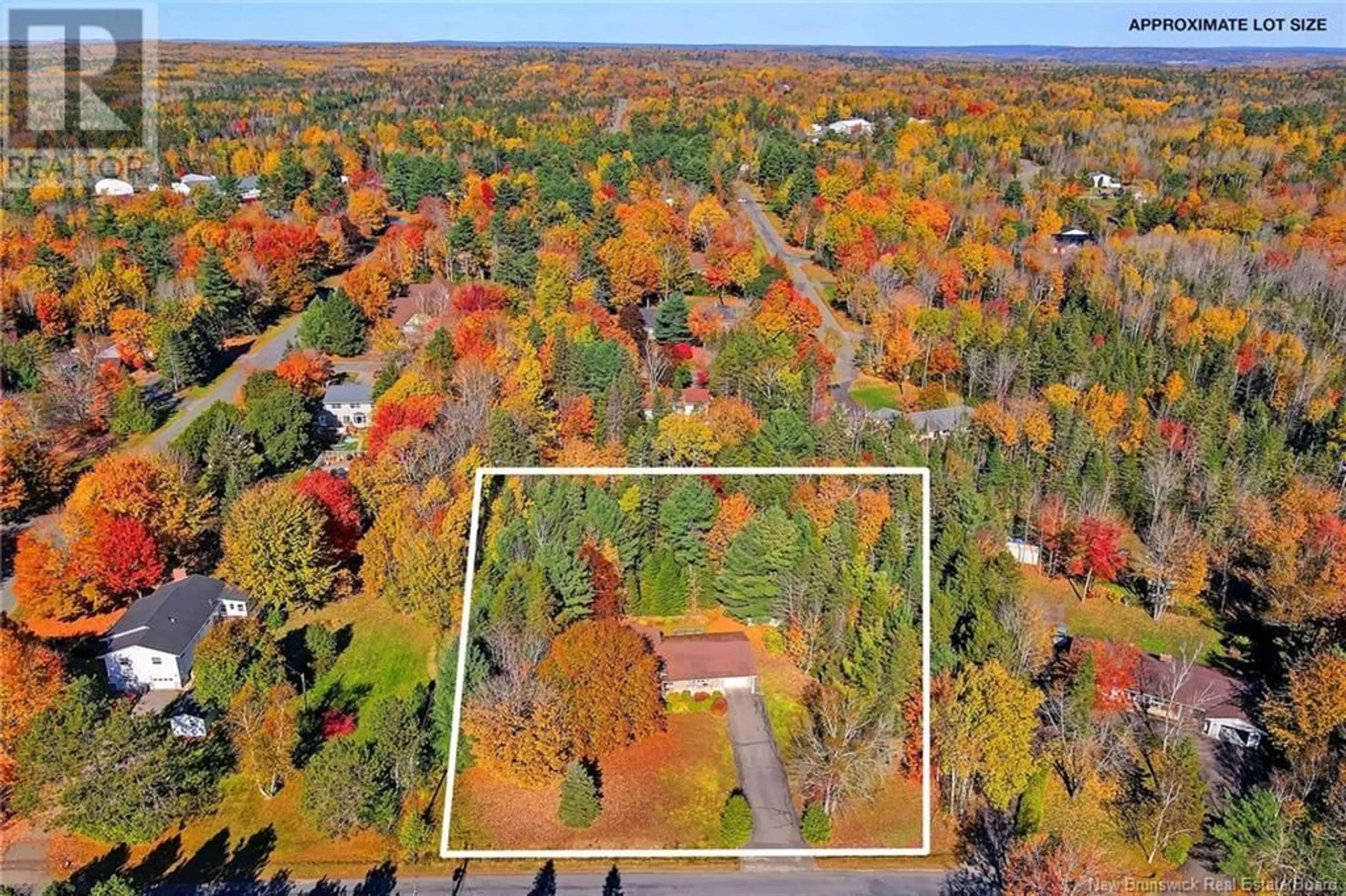 A pic from exterior of the house or condo, the fenced backyard for 9 Neptune Crescent, Hanwell New Brunswick E3C1M7