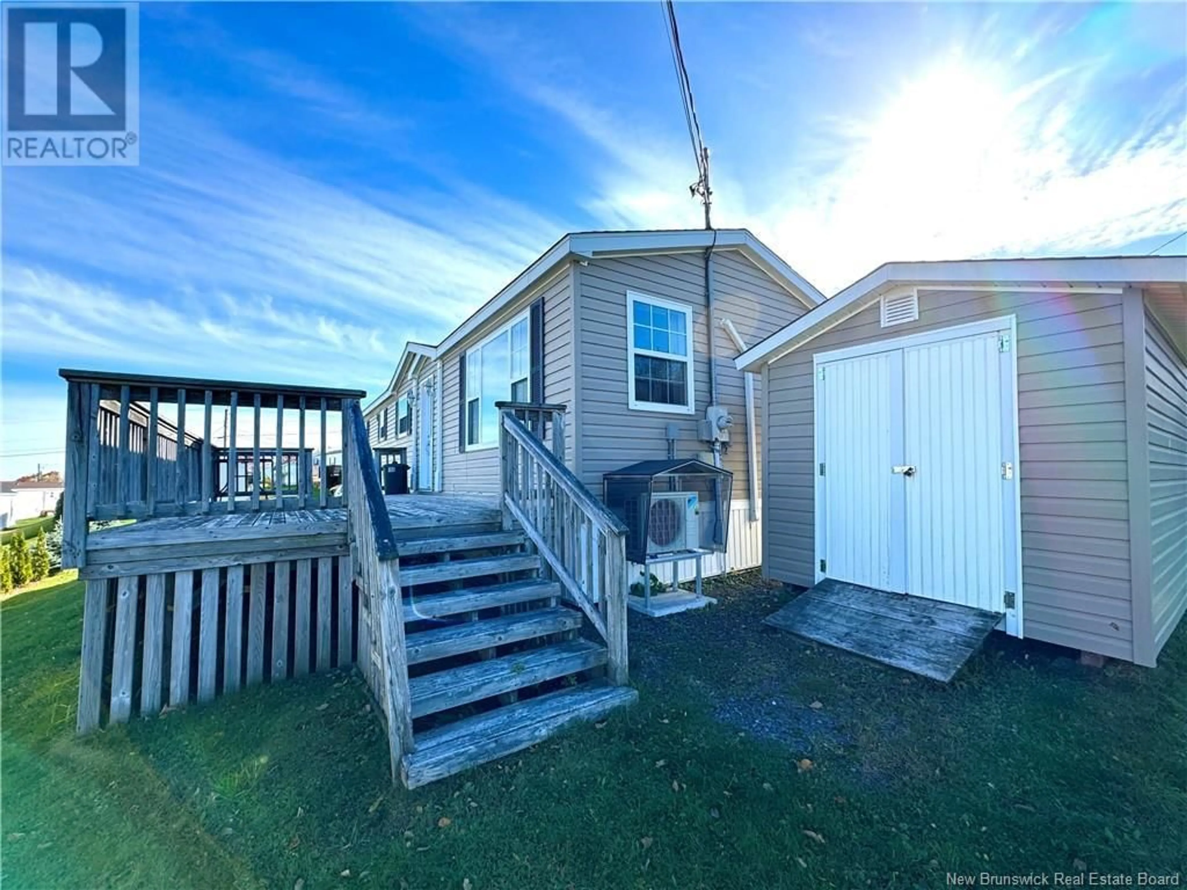 A pic from exterior of the house or condo, the fenced backyard for 43 Barrington Road, Fredericton New Brunswick E3C0A5