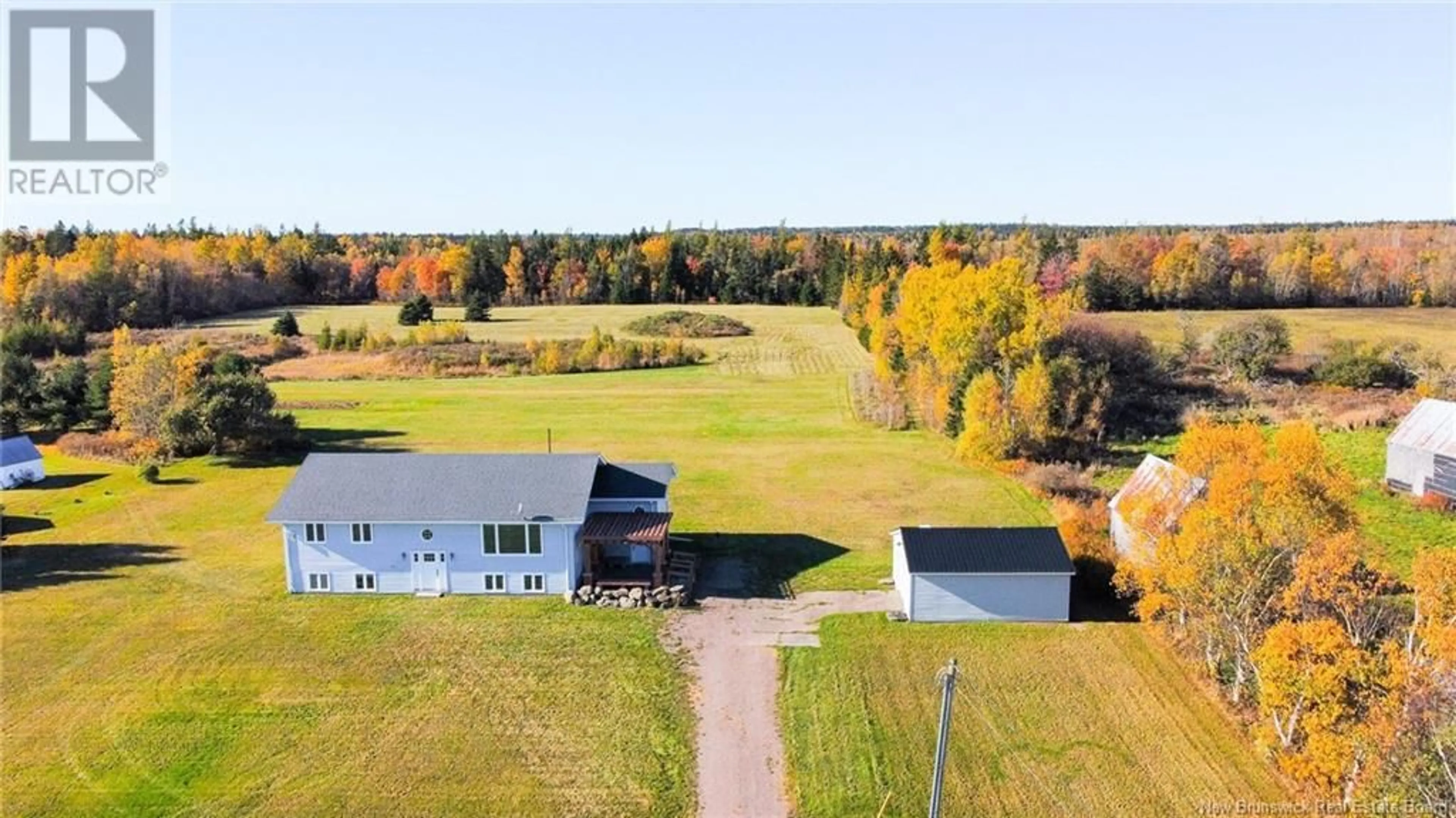 A pic from exterior of the house or condo, the fenced backyard for 180 Brooklyn Road, Sackville New Brunswick E4L1W1