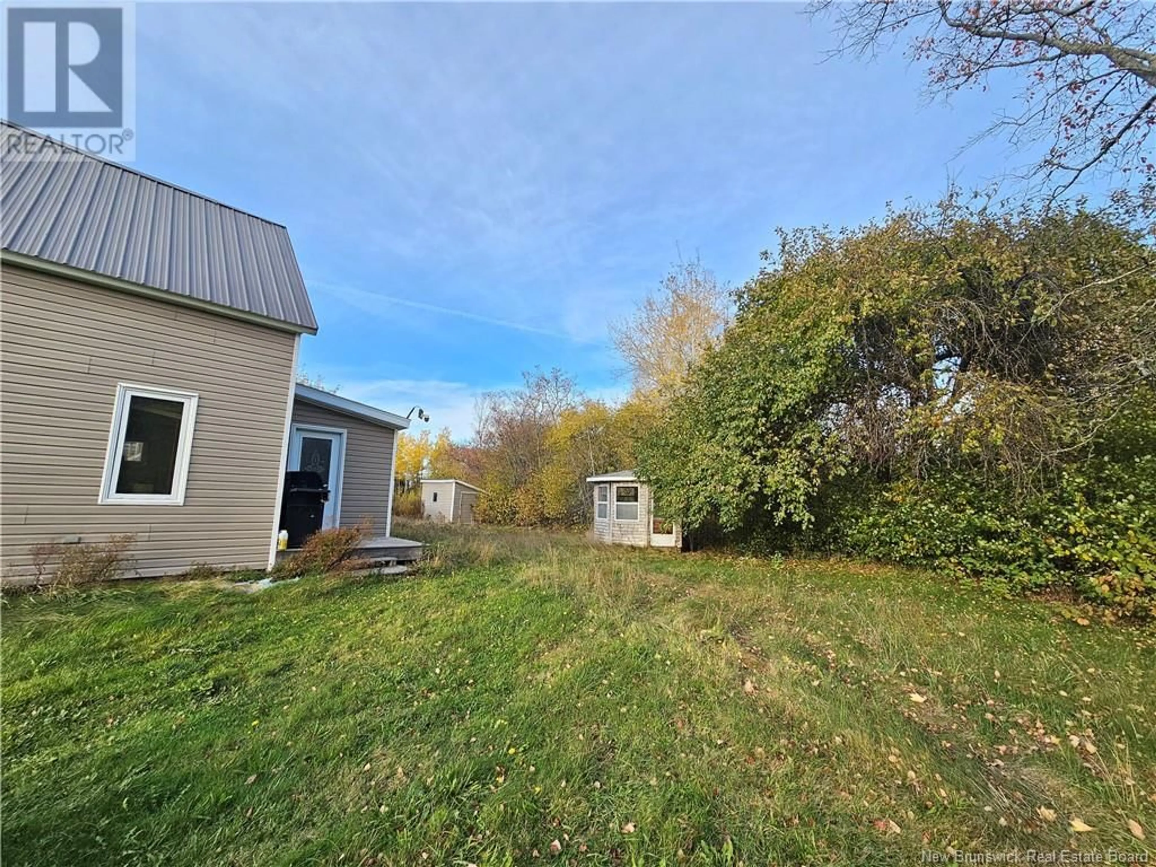 A pic from exterior of the house or condo, the fenced backyard for 28 Richard Lane, Shediac New Brunswick E4P2N6